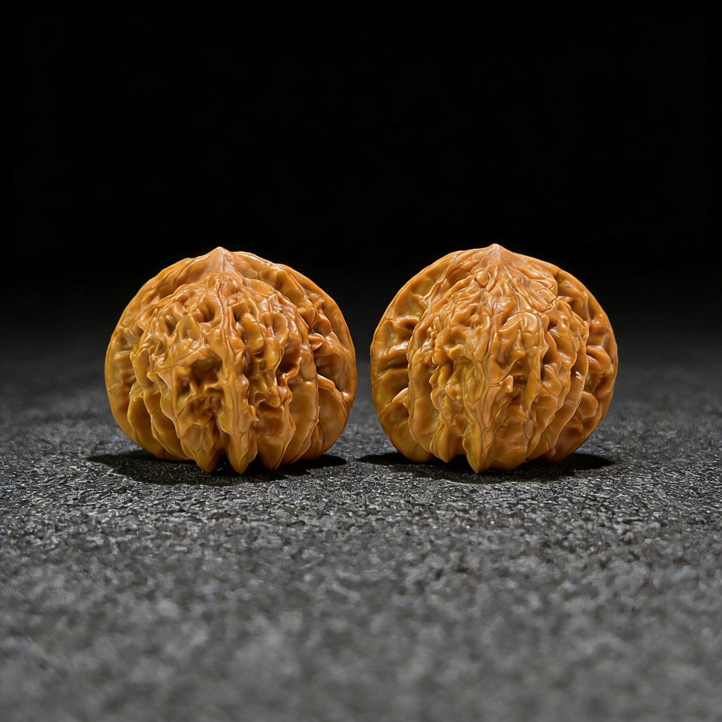 Walnut hand exercisers called Peach Heart by Tao Xin, featuring pair of 40mm and 36mm size walnut hand grips.