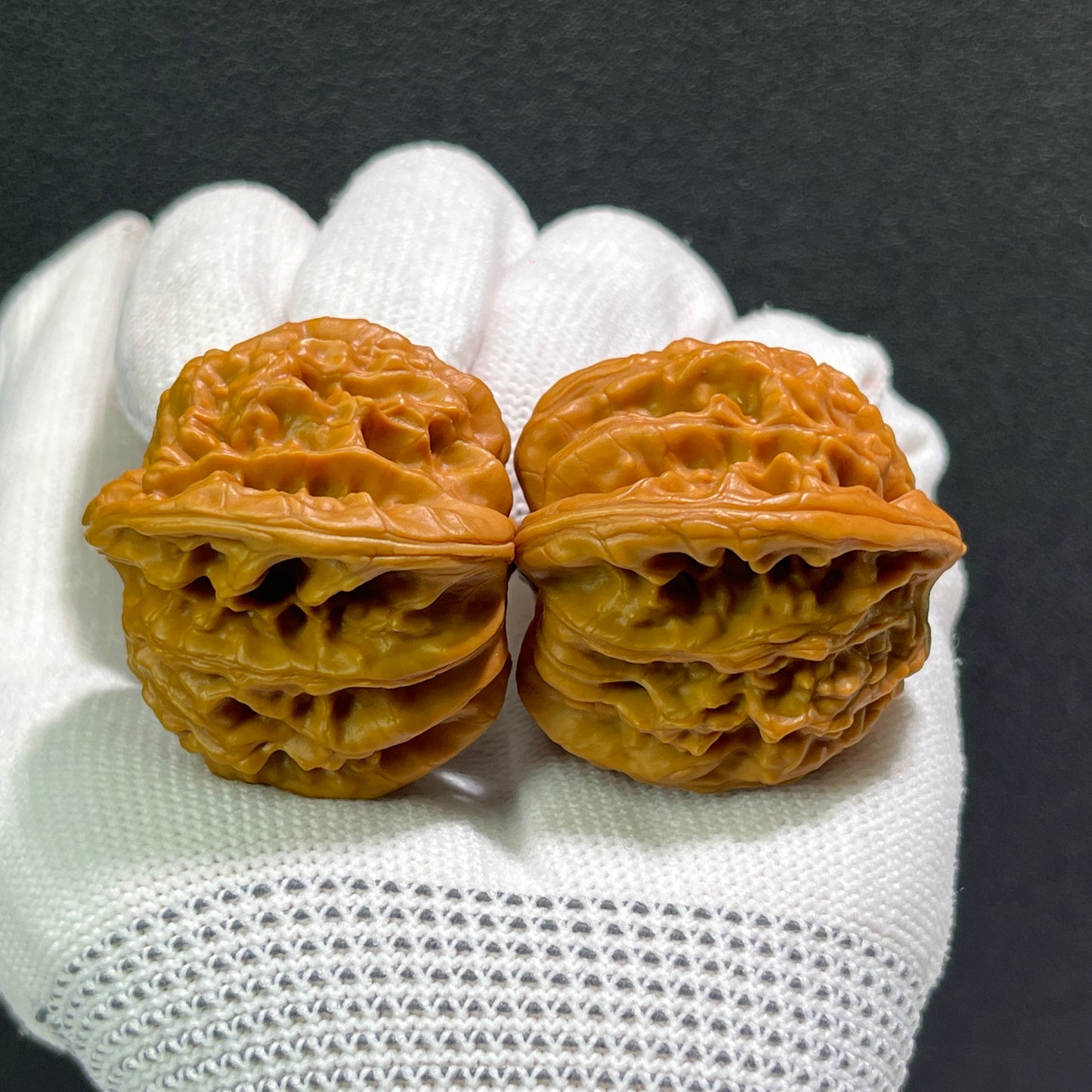 Walnut hand exercisers featuring peach heart design, Tao Xin Xia Yun Ling pair, 40mm x 36mm, by ThePatinaProject.