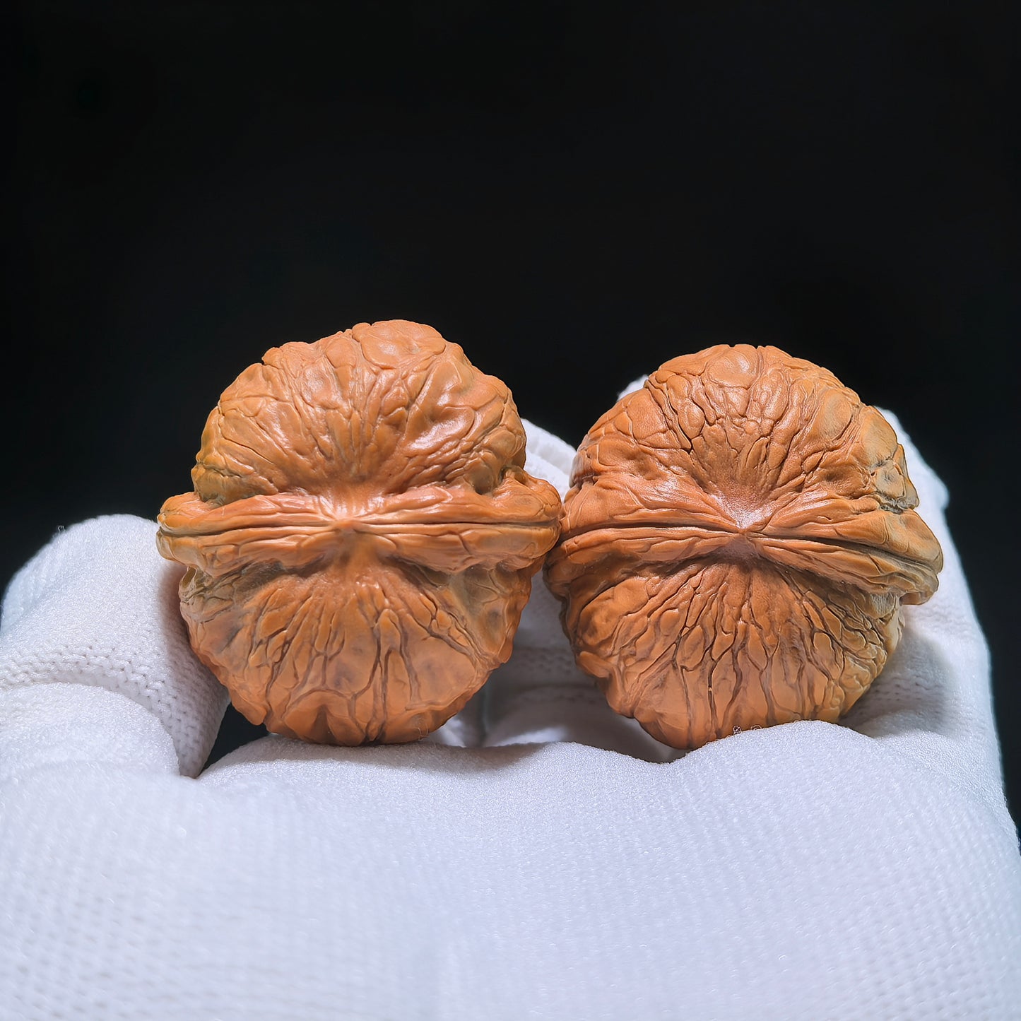 Pair of Pinggu "Ingot" walnut hand exercisers from ThePatinaProject, measuring 35mm by 37mm, crafted for grip and strength training.