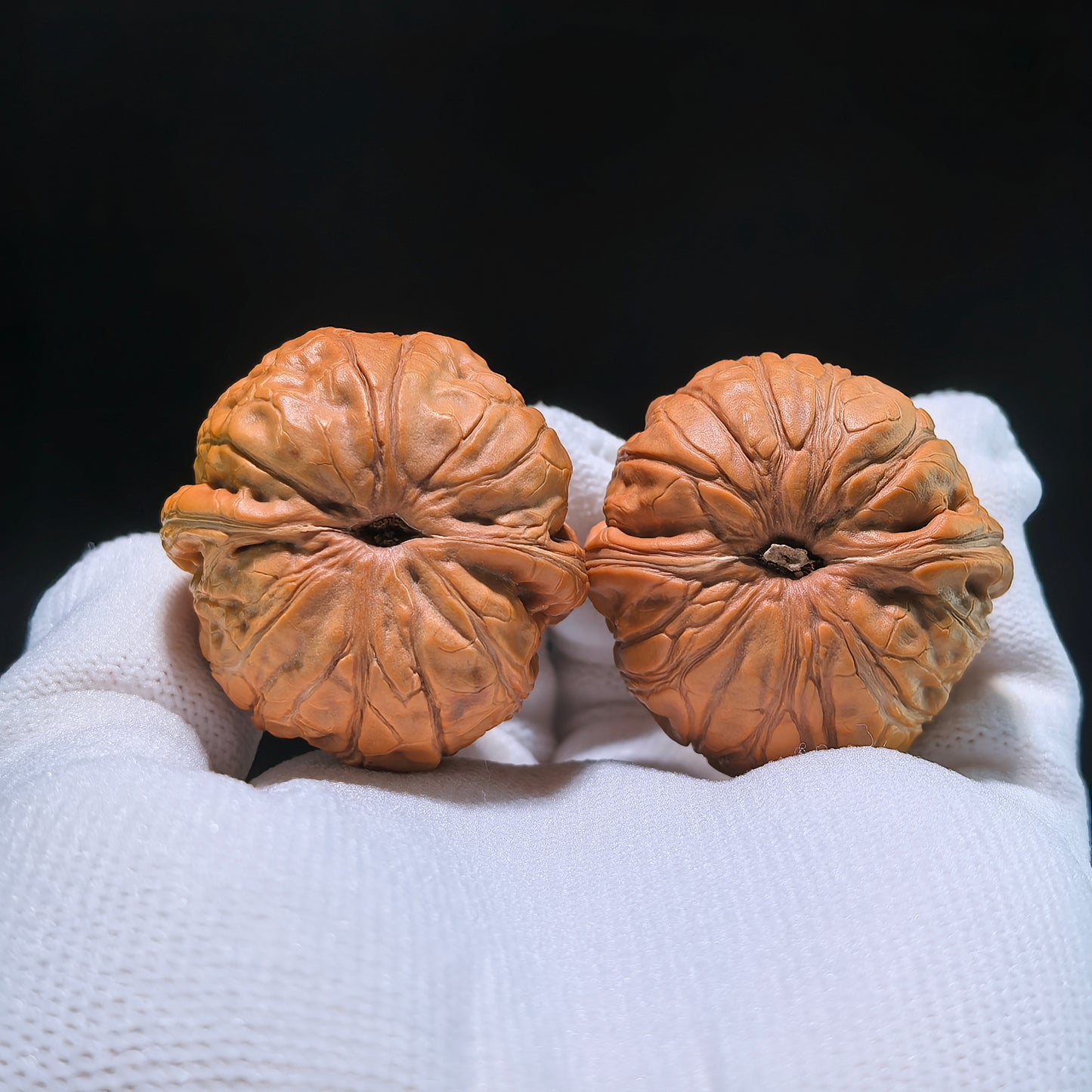 Pair of Pinggu "Ingot" walnut hand exercisers by ThePatinaProject, 35mm x 37mm, showcasing smooth, polished wooden grip tools.