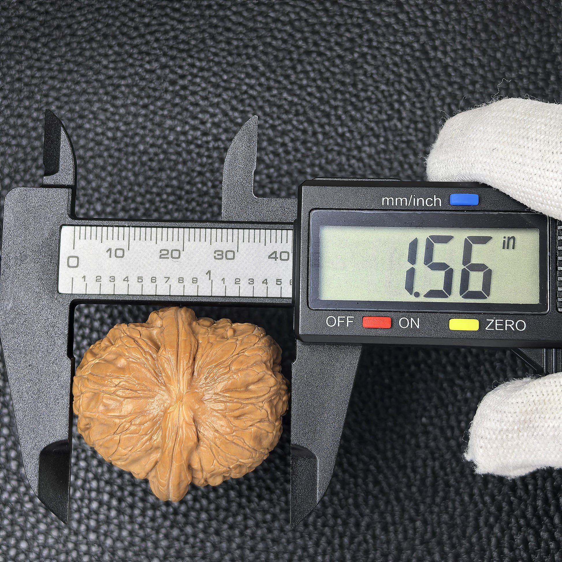 Pair of Pinggu Ingot walnut hand exercisers from ThePatinaProject, measuring 35mm x 39mm, designed for hand strengthening.