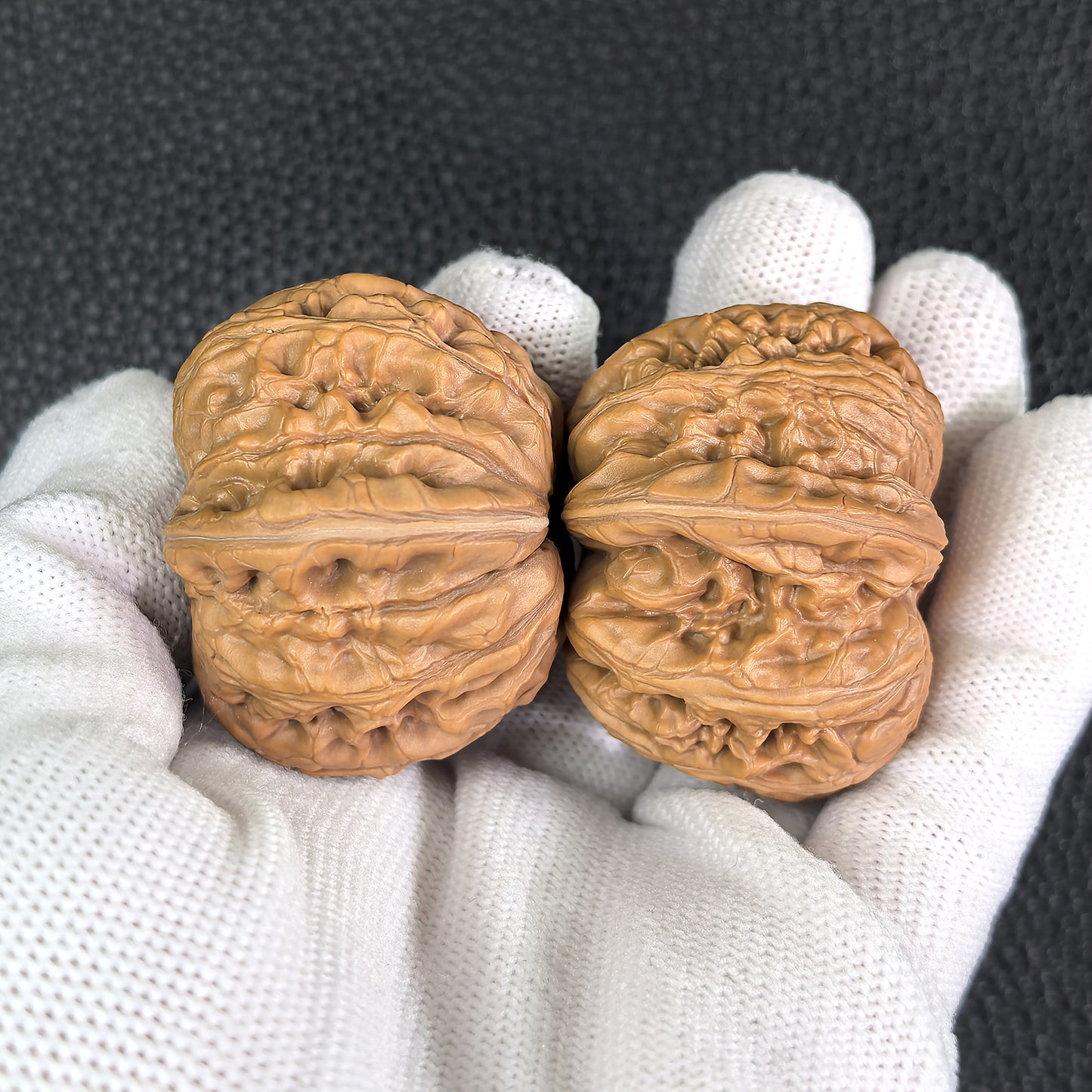 Pair of Walnut Hand Exercisers called Pinggu Ingot with 39mm and 42mm dimensions from ThePatinaProject.