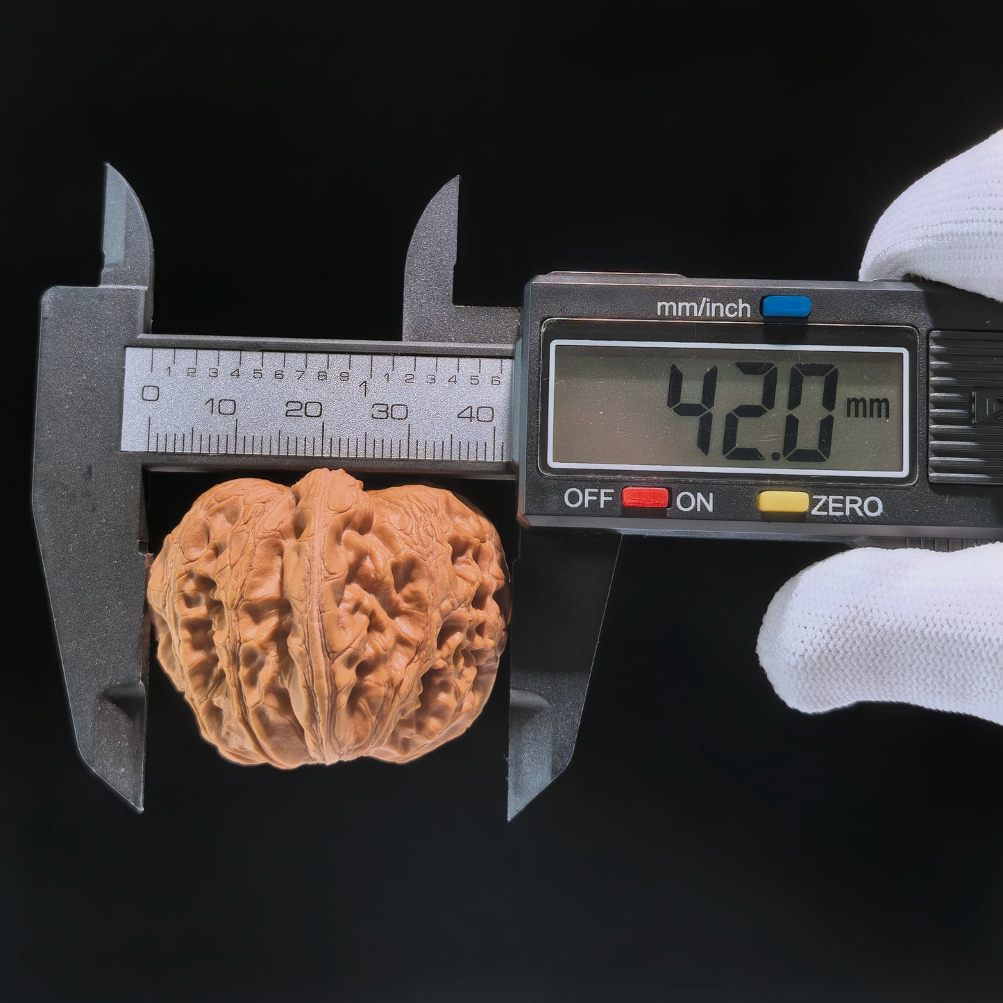 Pair of walnut hand exercisers shaped like ingots with "Ingot" design, 40x42mm, by ThePatinaProject for hand strengthening.