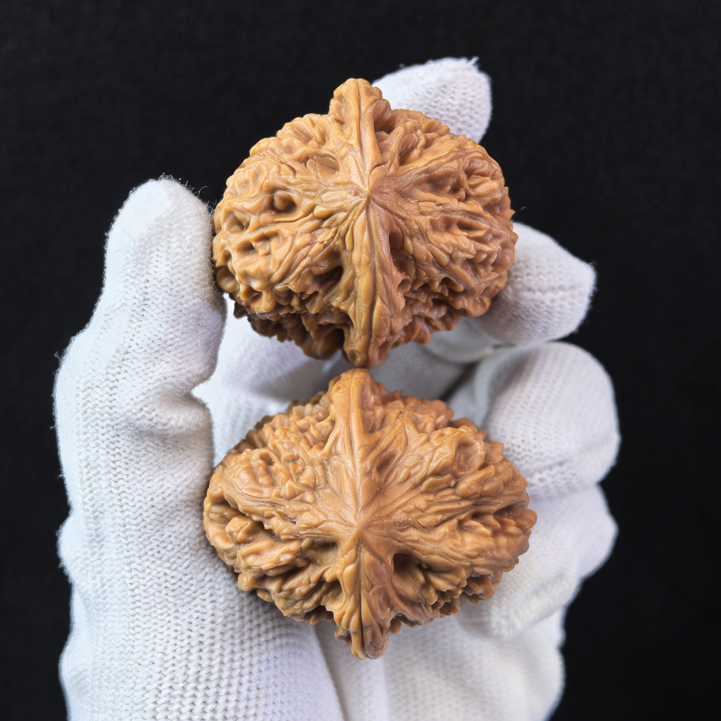 Pair of Pinggu Jin Zhong Walnut Hand Exercisers, 44mm, from ThePatinaProject, featuring golden bell design and smooth wooden finish.