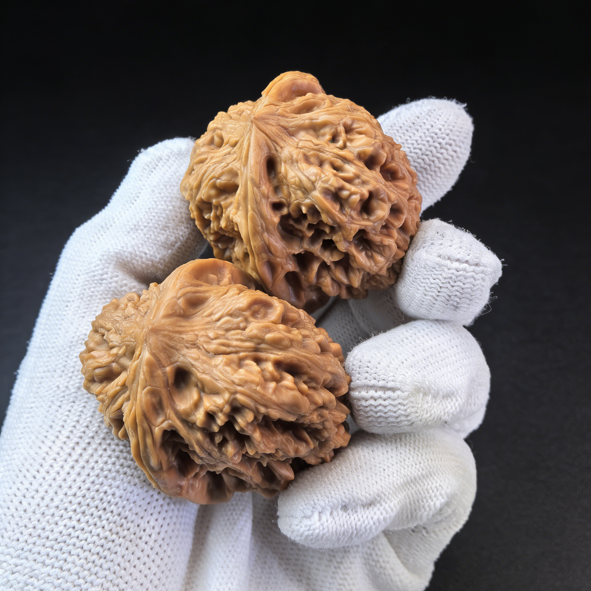 Pair of Pinggu Jin Zhong Walnut Hand Exercisers by ThePatinaProject, 44mm size, featuring golden bell design for hand strength.