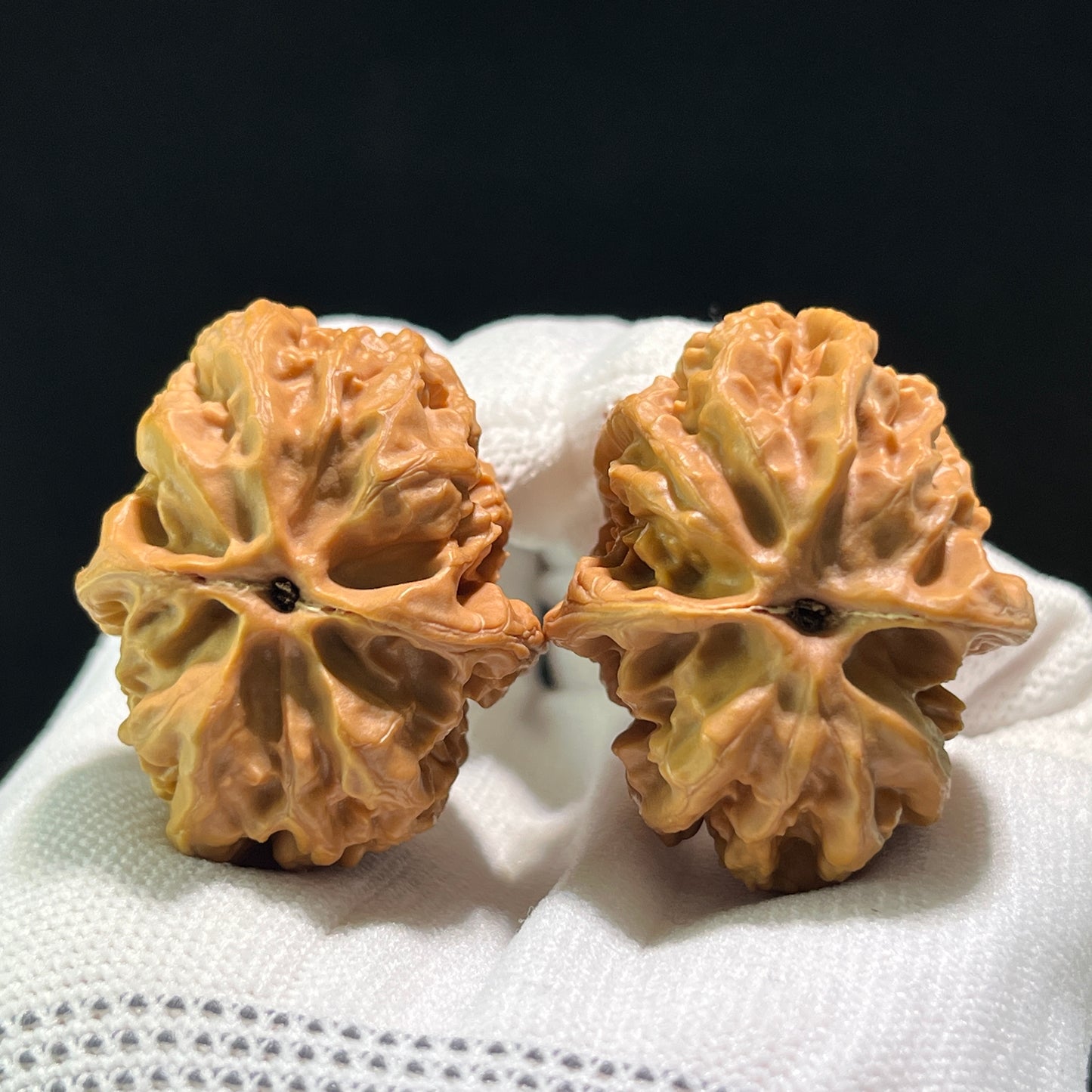 Pair of Pinggu "Square Box" walnut hand exercisers, 33x40mm, from ThePatinaProject, showcasing the wooden texture and craftsmanship.