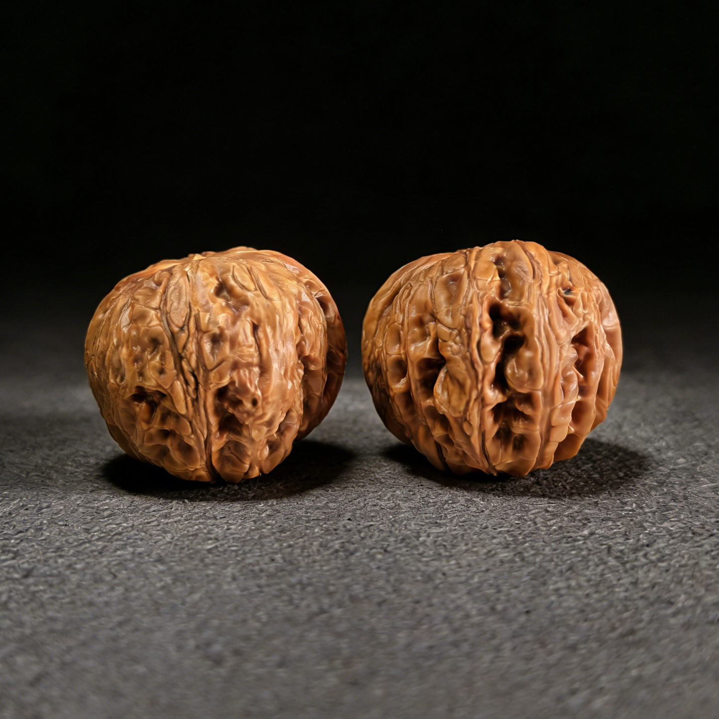 Pair of Pinggu Yuanbao gold ingot-shaped walnut hand exercisers by ThePatinaProject, 38mm, featuring detailed gold ingot design.
