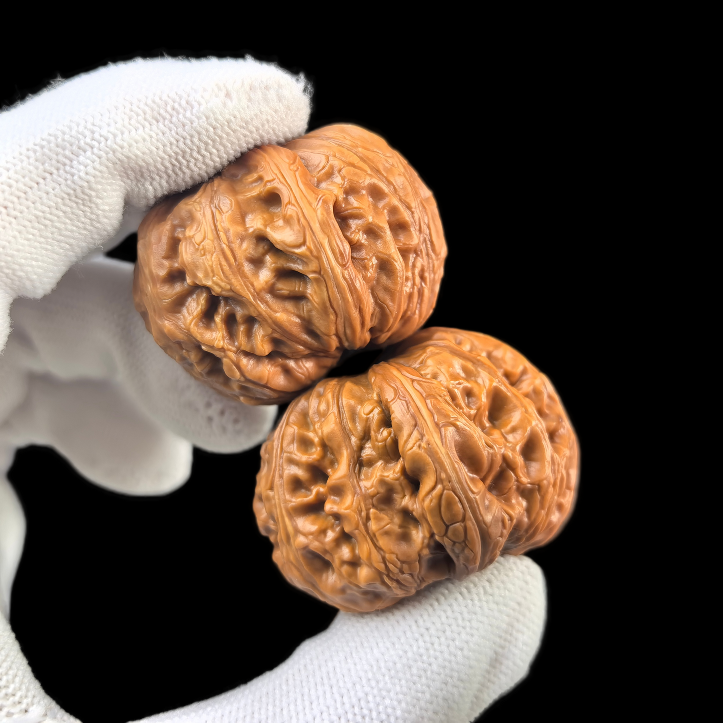 Pair of Pinggu Yuanbao gold ingot walnut hand exercisers from ThePatinaProject, 38mm, with detailed carved gold ingot design.