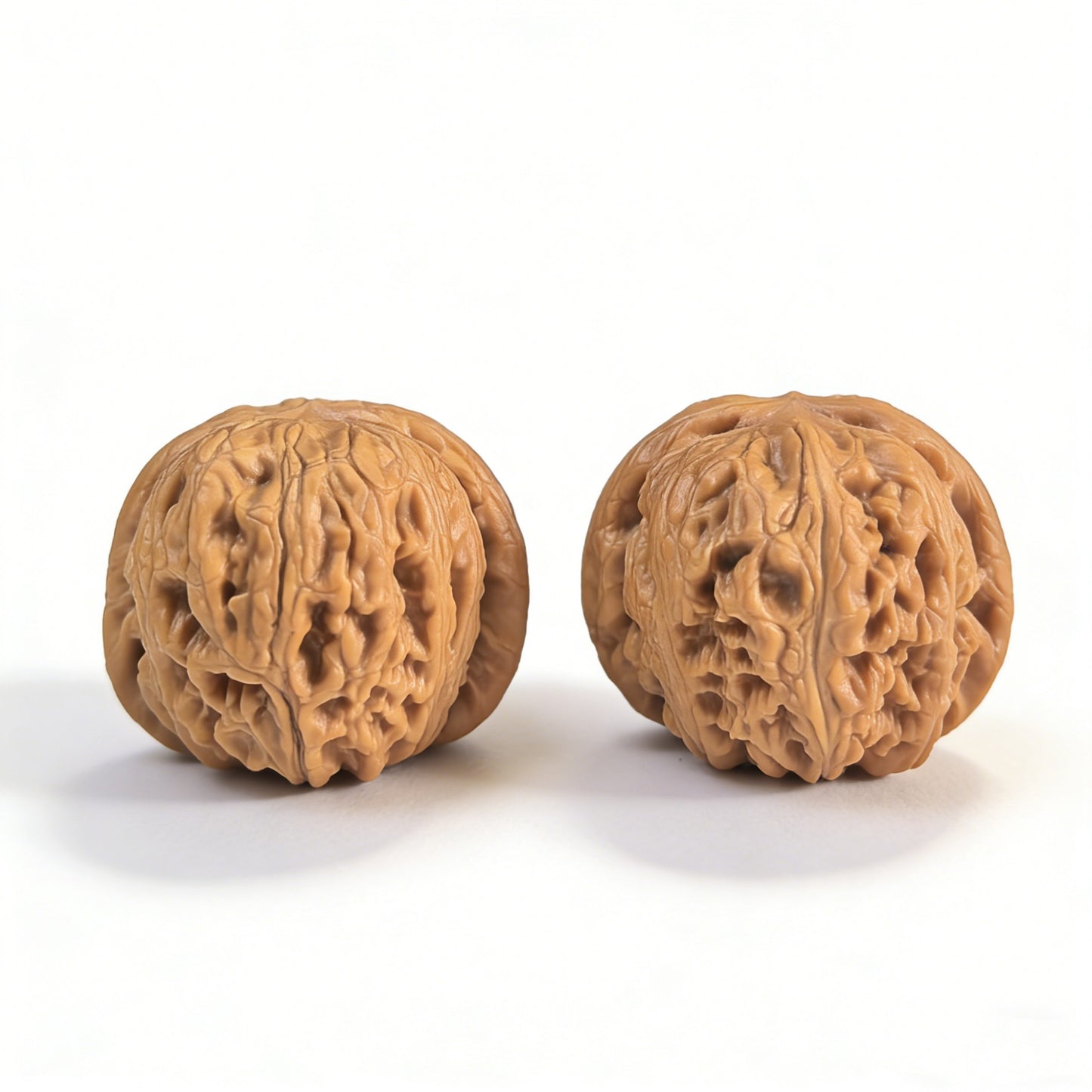 Pair of Pinggu Yuanbao walnut hand exercisers by ThePatinaProject, 40mm gold ingot-shaped grips for hand strengthening and stress relief.