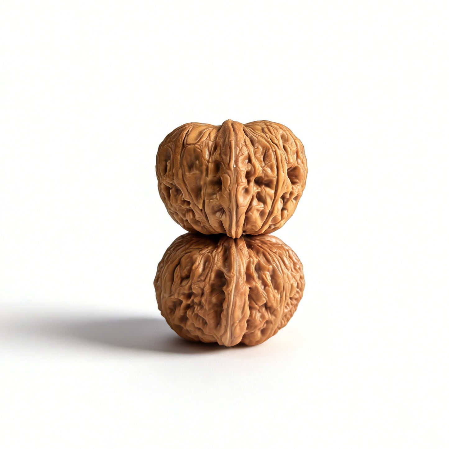 Pair of Pinggu Yuanbao walnut hand exercisers from ThePatinaProject, 40mm gold ingot-shaped wooden grips for hand strength training.