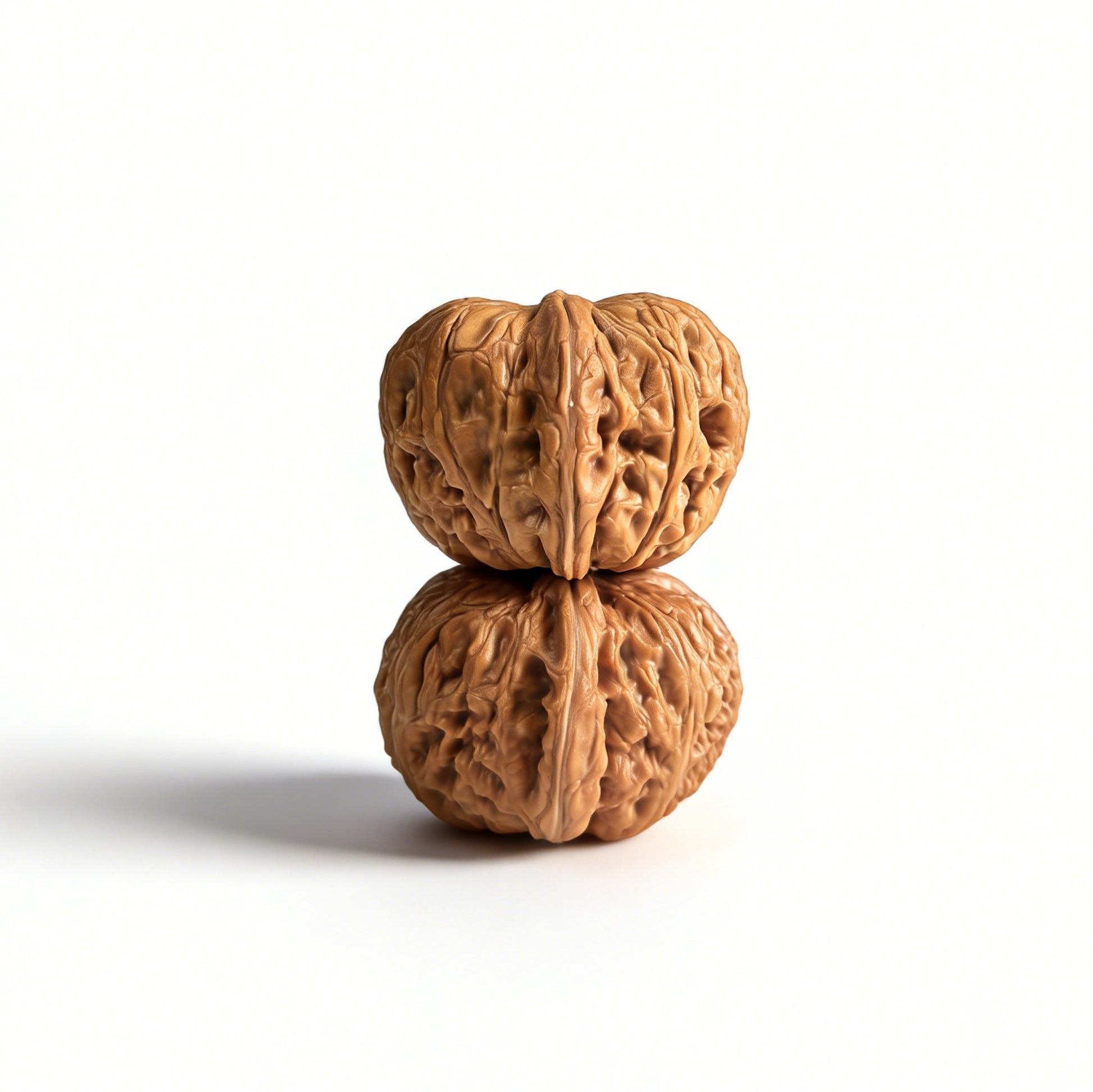 Pair of Pinggu Yuanbao walnut hand exercisers from ThePatinaProject, 40mm gold ingot-shaped wooden grips for hand strength training.