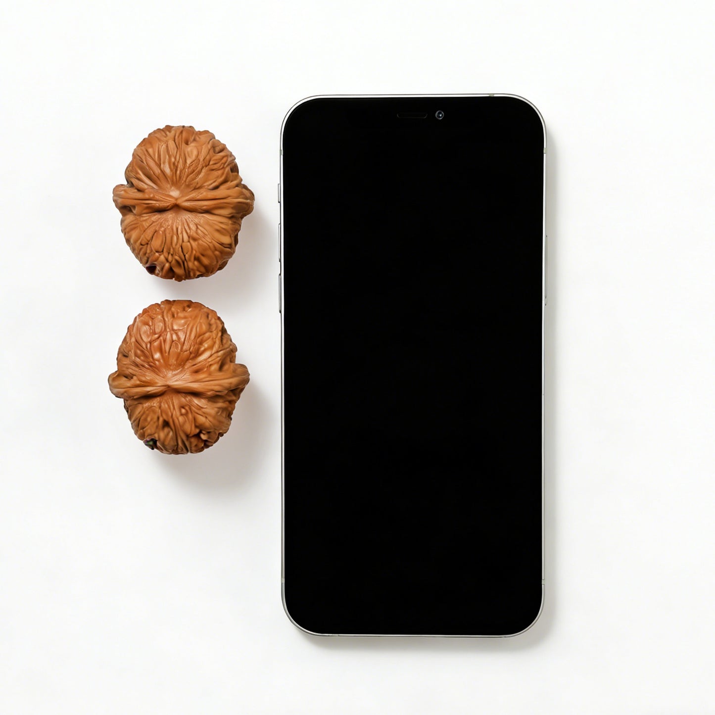 Pair of Pinggu Yuanbao gold ingot-shaped walnut hand exercisers from ThePatinaProject, 40mm size, with textured surface.