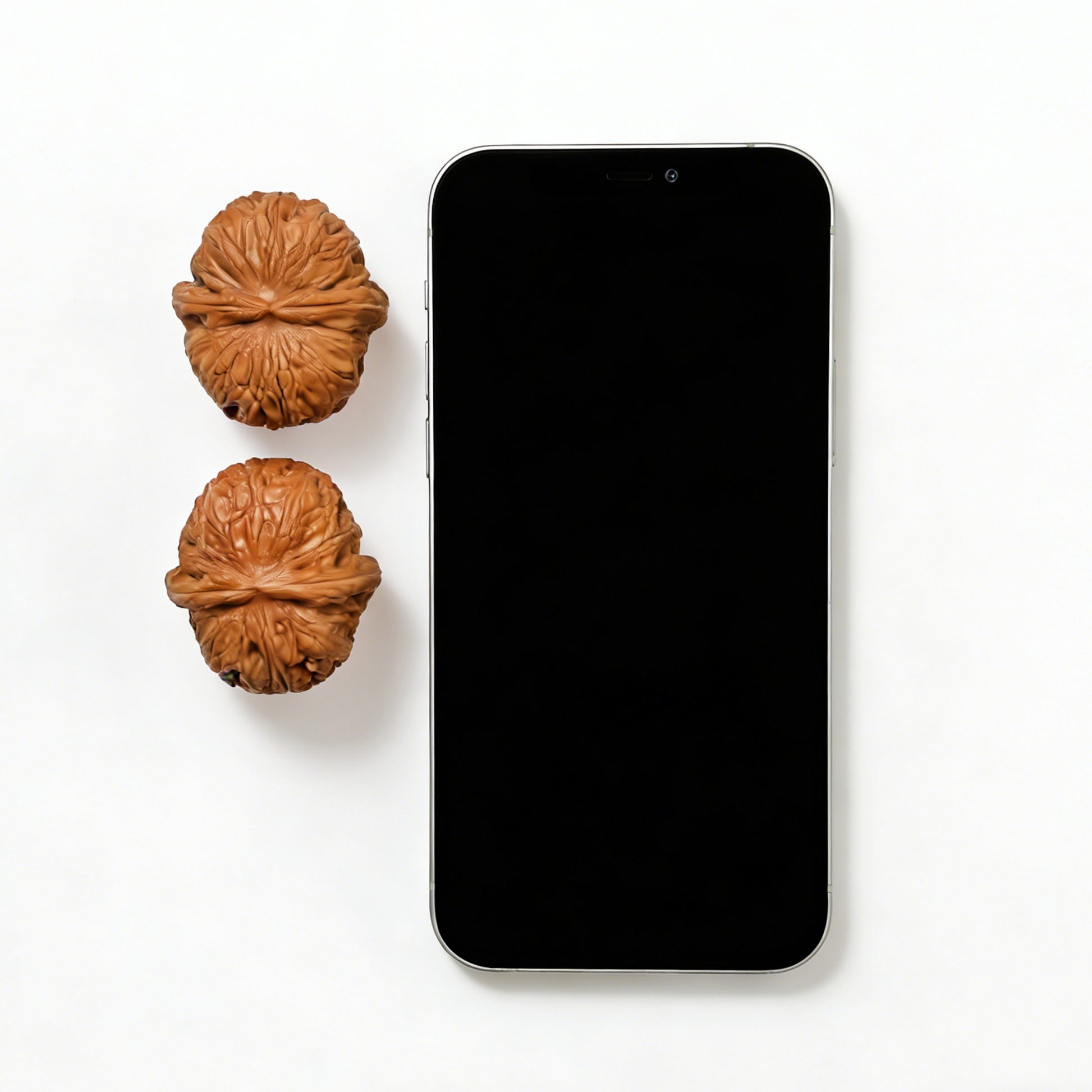 Pair of Pinggu Yuanbao gold ingot-shaped walnut hand exercisers from ThePatinaProject, 40mm size, with textured surface.