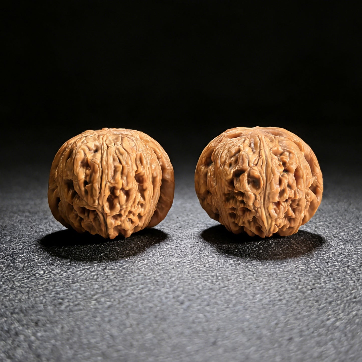 Pair of Pinggu Yuanbao walnut hand exercisers by ThePatinaProject, 40mm gold ingot-shaped grip tools for hand strength training.