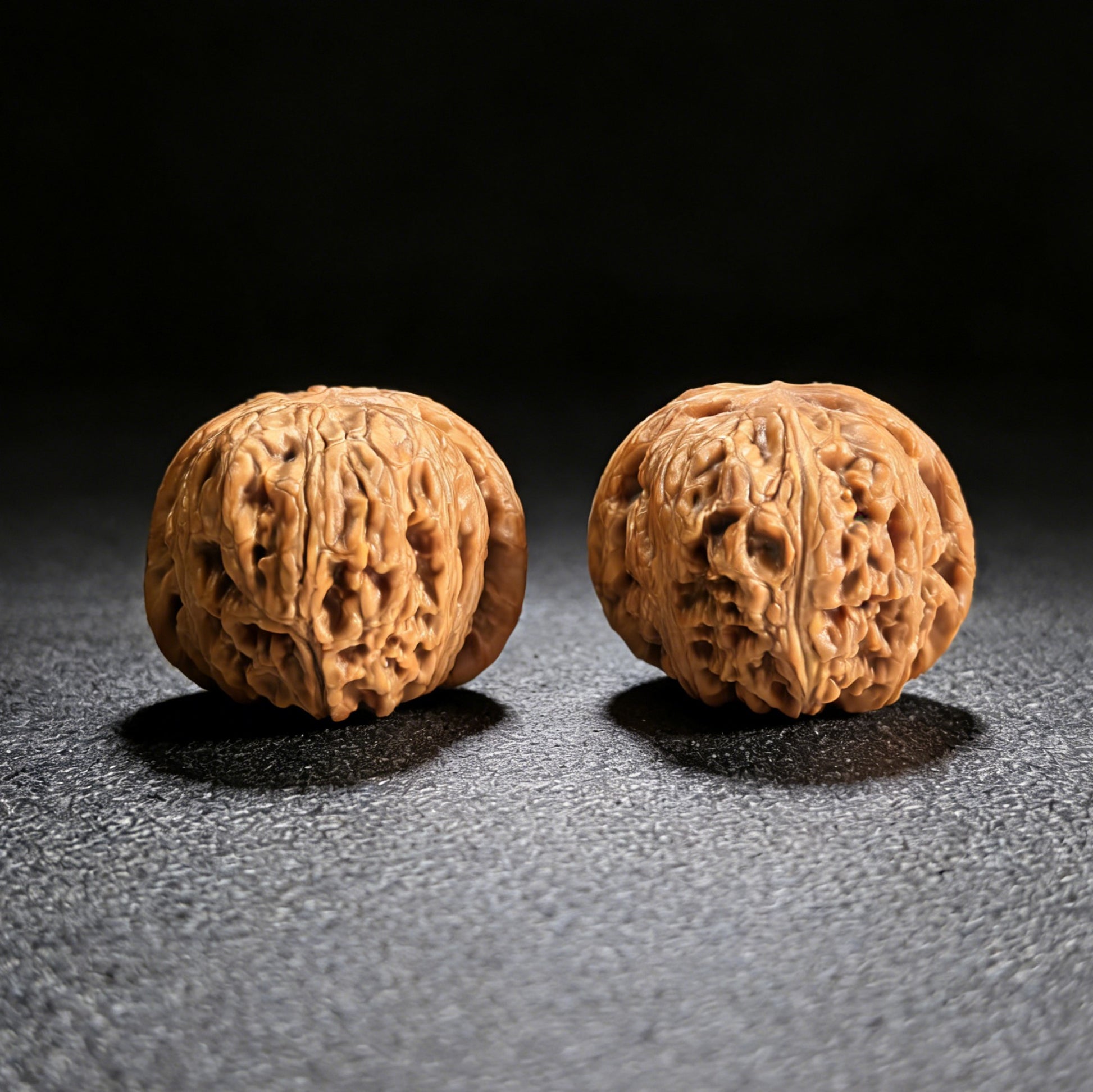 Pair of Pinggu Yuanbao walnut hand exercisers by ThePatinaProject, 40mm gold ingot-shaped grip tools for hand strength training.