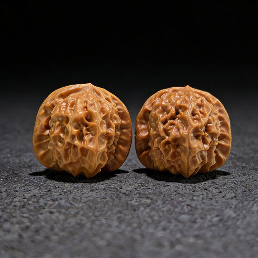 Pair of Walnut Hand Exercisers with porcelain doll Chengde seal design, 35mm, boutique grade from ThePatinaProject.