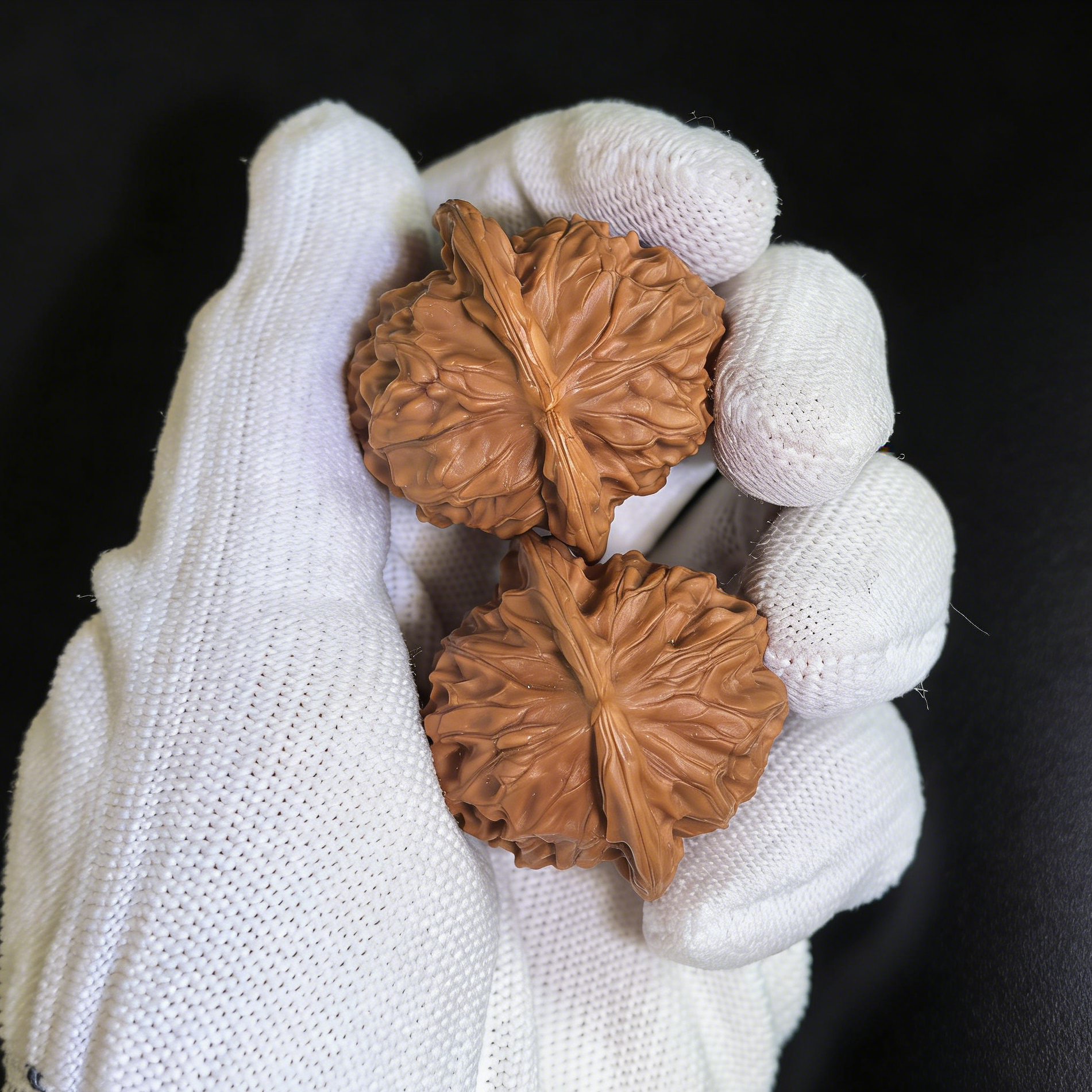 Pair of Walnut Hand Exercisers with Porcelain Doll design, 35mm micro-grain texture, from ThePatinaProject collector’s set.