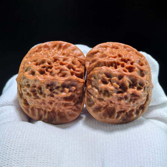 Pair of Walnut Hand Exercisers featuring the Porcelain Doll Official Seal, boutique grade, 42mm by 37mm, from ThePatinaProject.