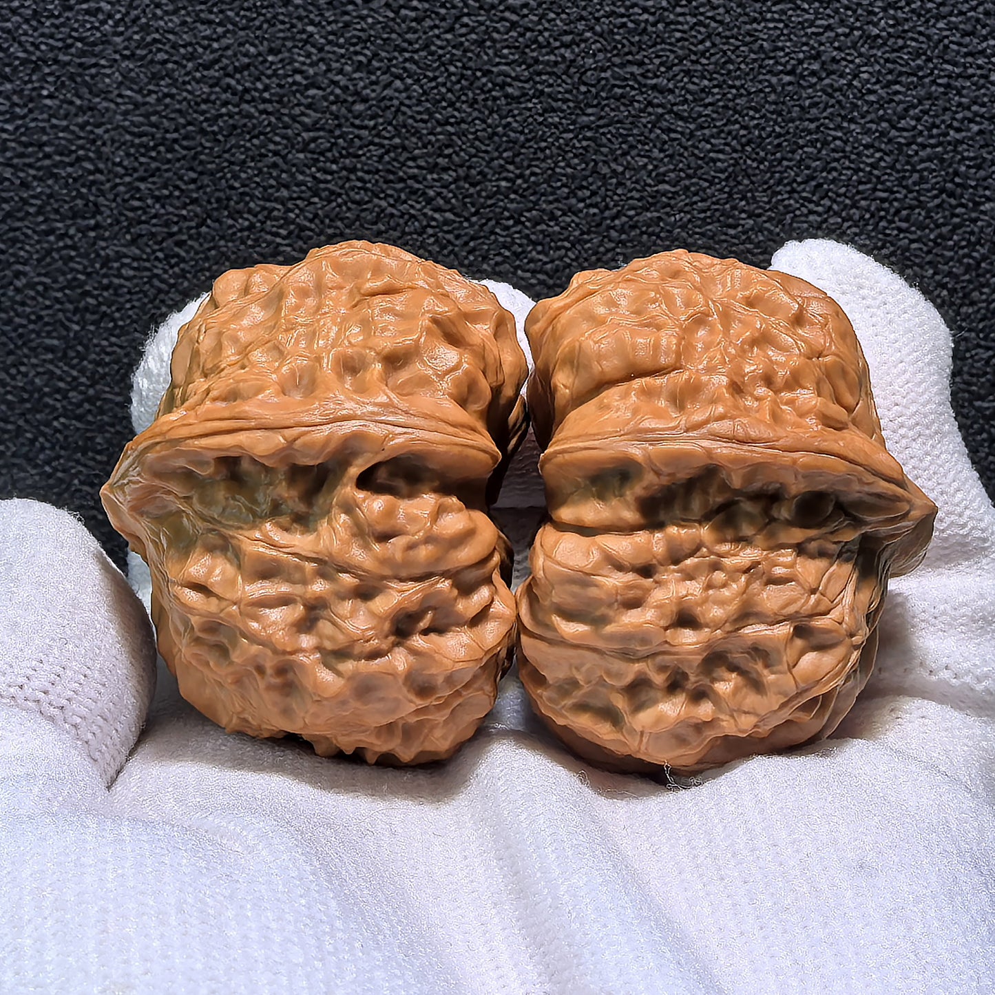 Walnut hand exercisers called Pumpkin Squat pair, 41mm x 43mm, by ThePatinaProject, showing textured walnut surfaces for hand grip.