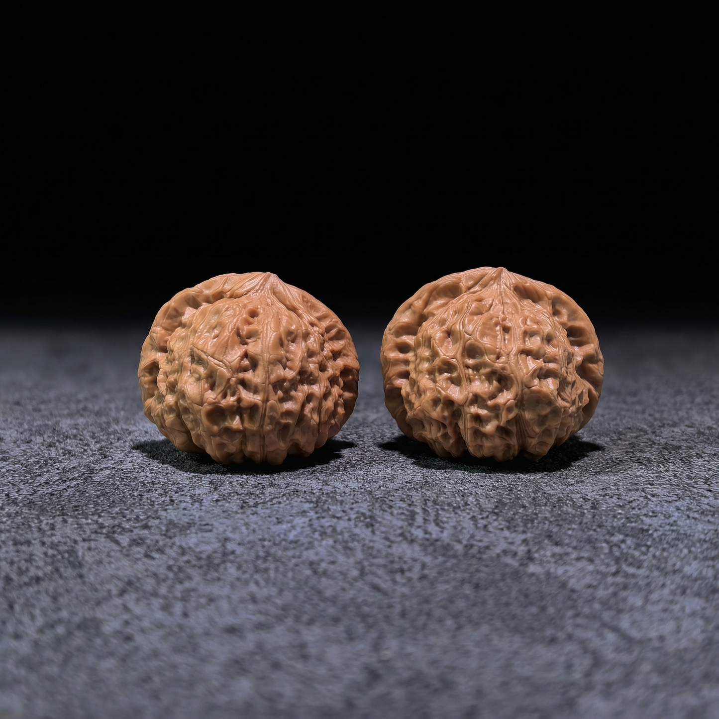Walnut hand exercisers called Pumpkin Squat, 41mm x 43mm, designed for finger strength and grip training by ThePatinaProject