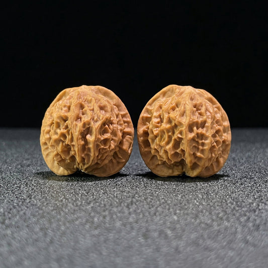 Pair of walnut hand exercisers from ThePatinaProject, 38mm x 35mm, featuring smooth wooden finish for grip and durability.