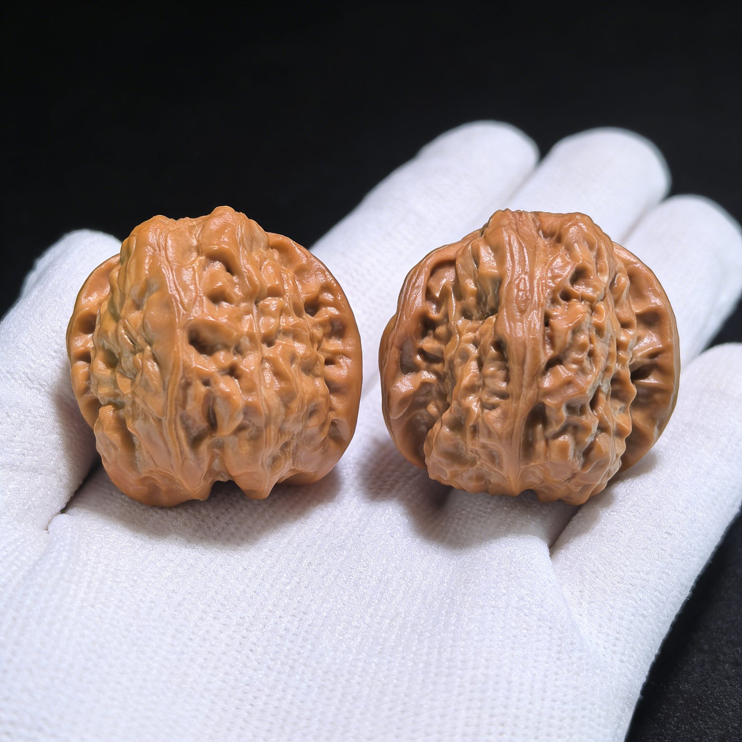 Walnut hand exerciser pair labeled "Frog Snake" from ThePatinaProject, 33mm x 34mm x 30mm, featuring detailed carved designs.
