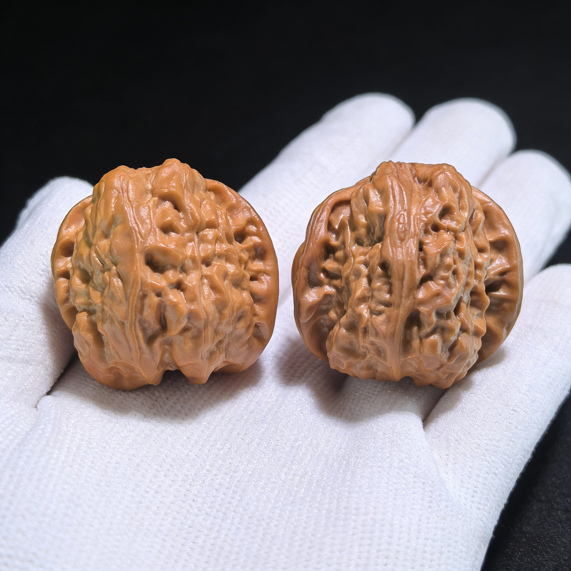 Walnut hand exerciser pair labeled "Frog Snake" from ThePatinaProject, 33mm x 34mm x 30mm, featuring detailed carved designs.