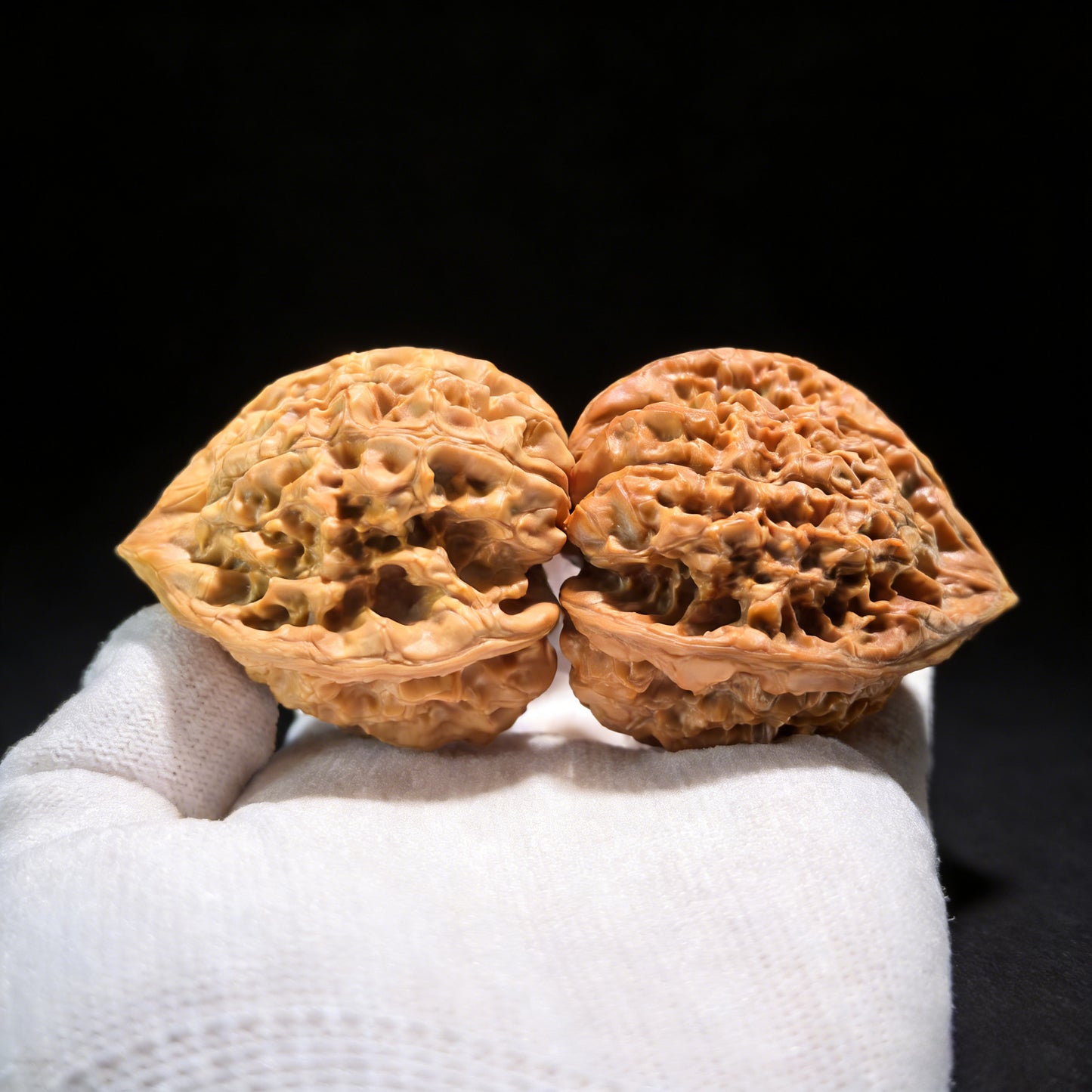 Walnut hand exercisers from ThePatinaProject, triangle-shaped collector's pair with 38mm and 49mm dimensions, DGMSN-02E model.