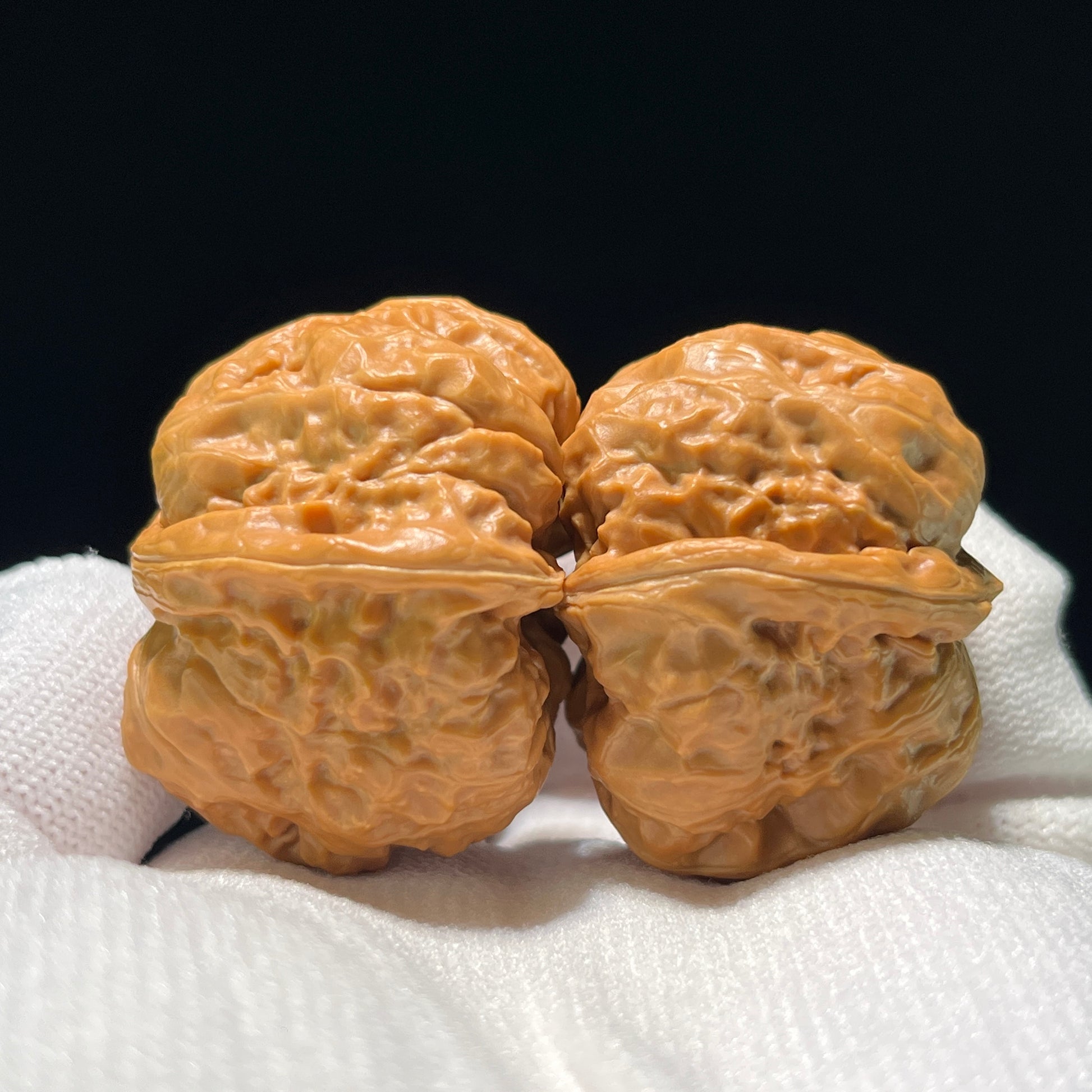 Walnut hand exercisers from ThePatinaProject featuring the Rare Triangle "Toad Head" collector's pair, 37mm square size.