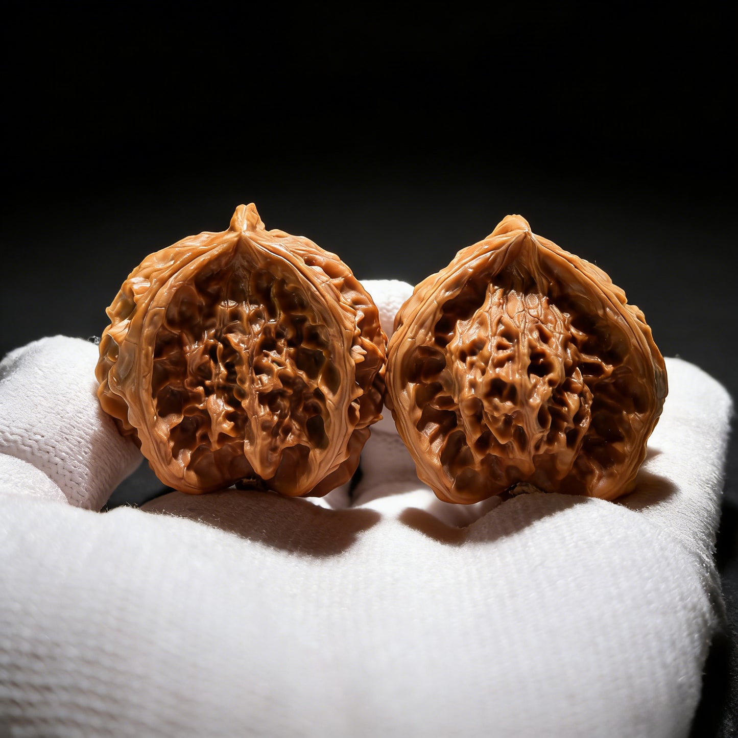 Walnut hand exercisers by ThePatinaProject featuring Spartan helmet motif, triangular shape, measuring 36mm each side, collector's pair
