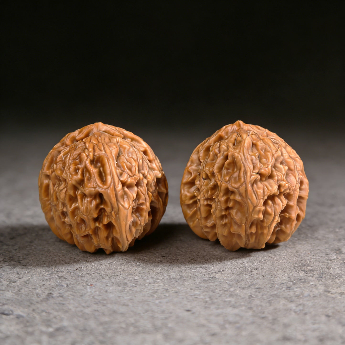 Pair of The Rare Triangular White Lion Walnut Hand Exercisers from ThePatinaProject, 36mm size, with detailed carved white lion design.