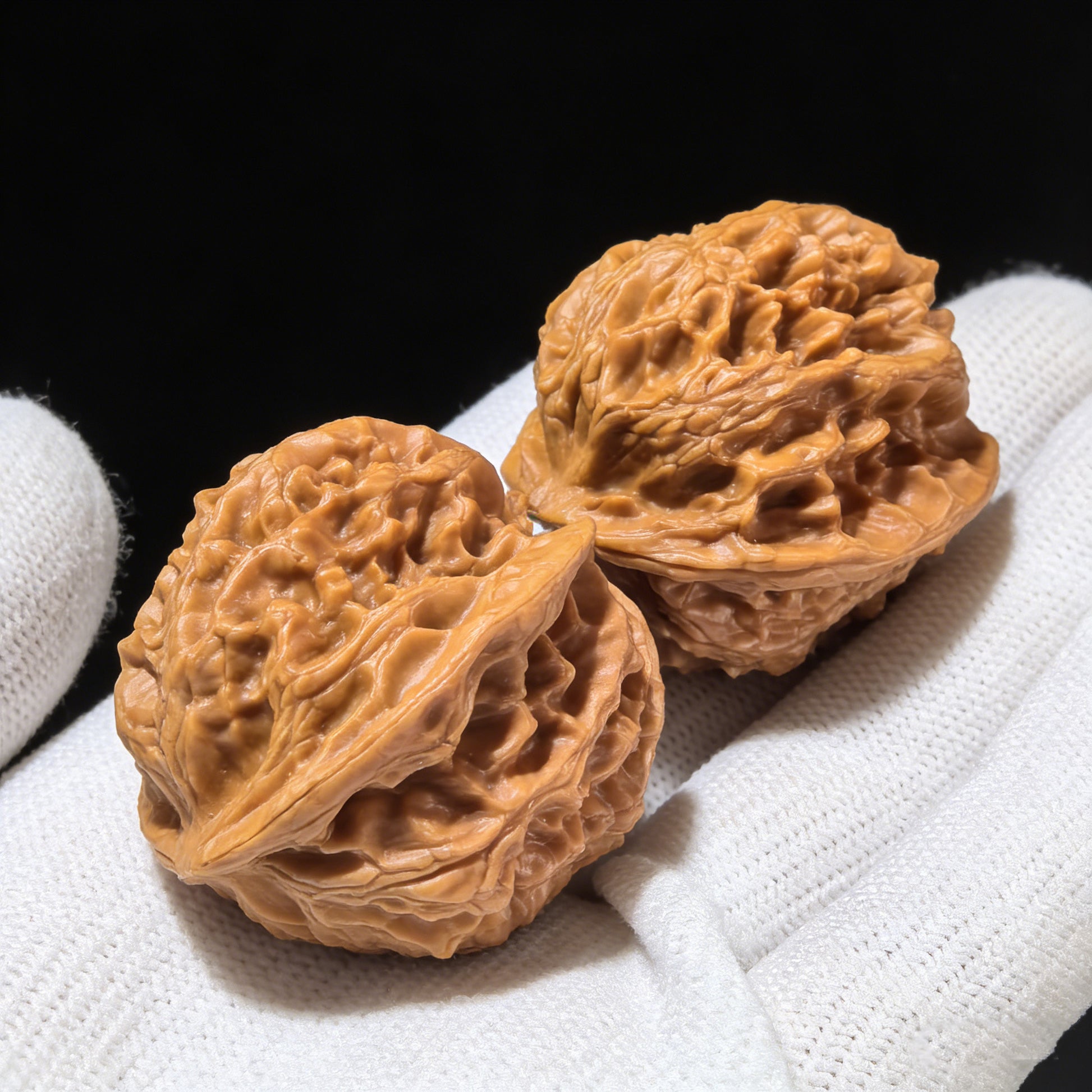 Pair of Red Jade Walnut Hand Exercisers from ThePatinaProject, 33mm size, showing polished red jade and carved walnut handles.