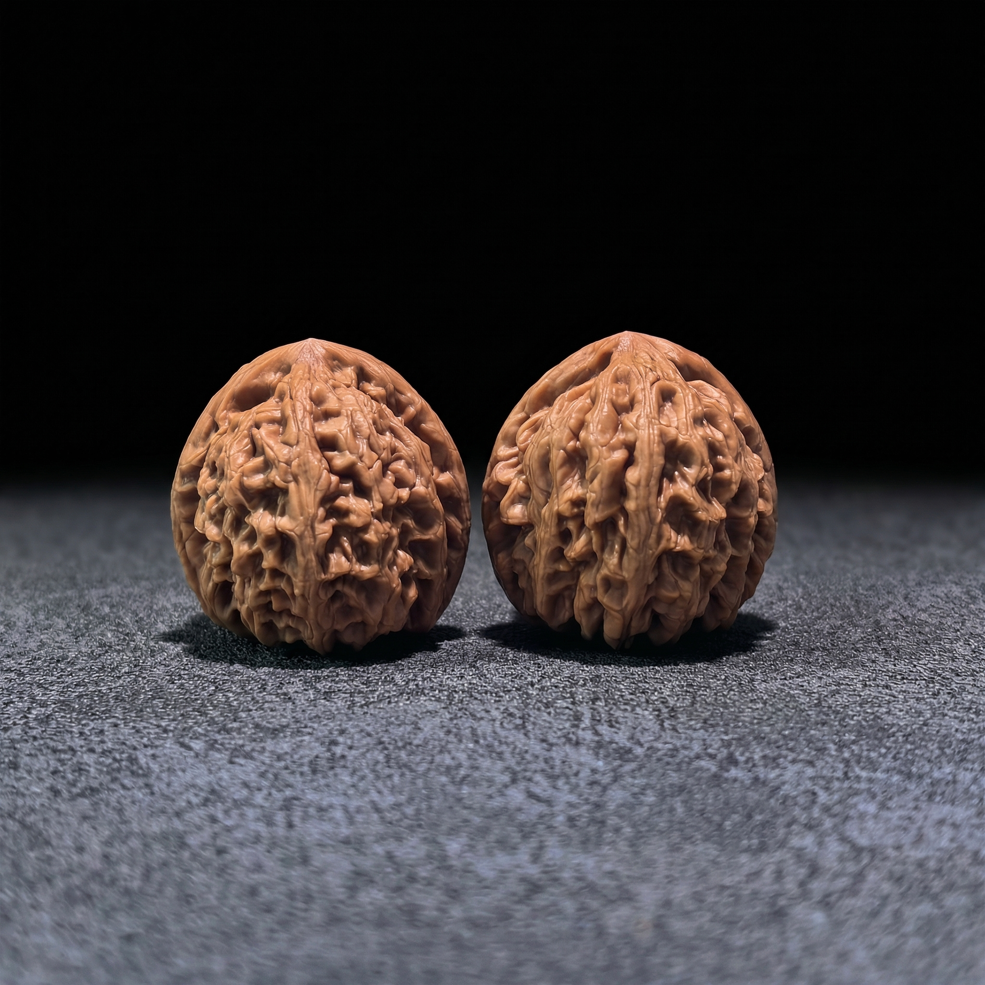 Pair of Walnut Hand Exercisers named "Red Koi" by ThePatinaProject, boutique grade, 40mm size with detailed wood grain.