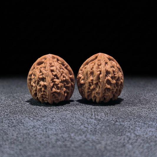 Pair of Walnut Hand Exercisers named "Red Koi" by ThePatinaProject, boutique grade, 40mm size with detailed wood grain.