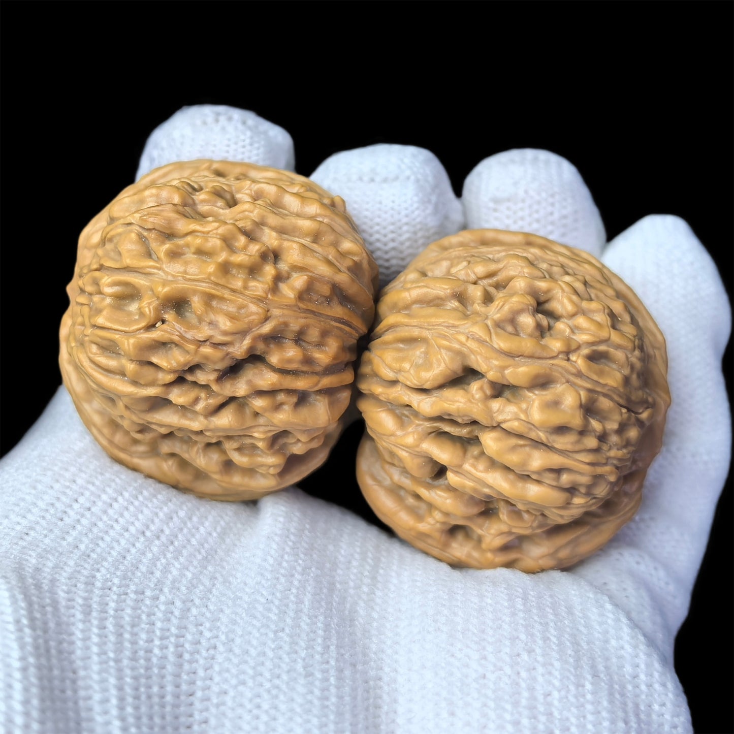 Pair of walnut hand exercisers with lion head design, 36mm size, from ThePatinaProject's Si Zuo Lou collection.