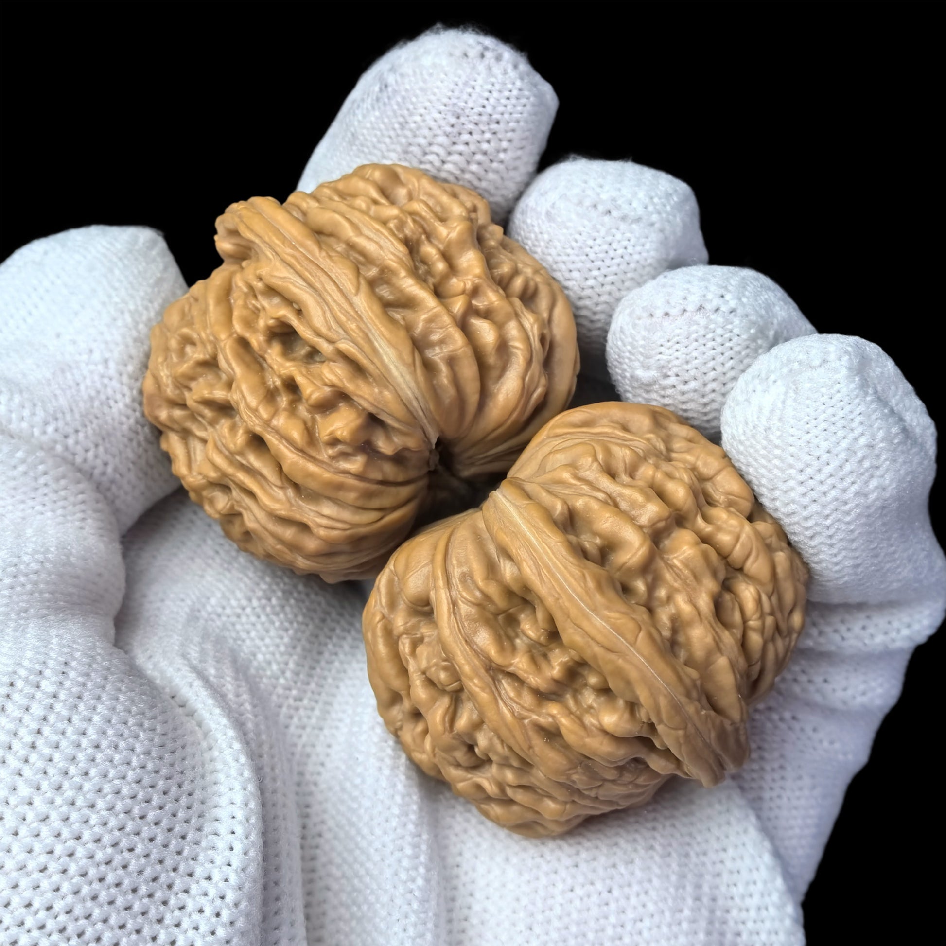 Pair of walnut lion head hand exercisers by ThePatinaProject, 36mm diameter, featuring detailed carved lion head designs.