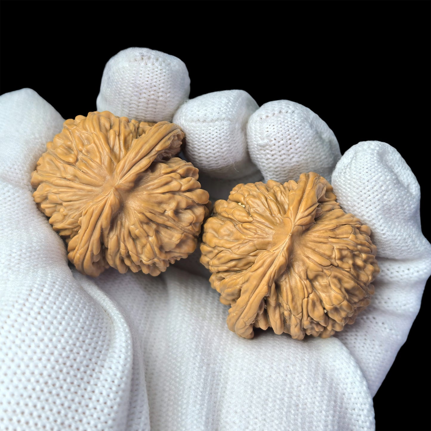 Pair of walnut lion head hand exercisers from ThePatinaProject, 36mm, featuring detailed carved lion head design.