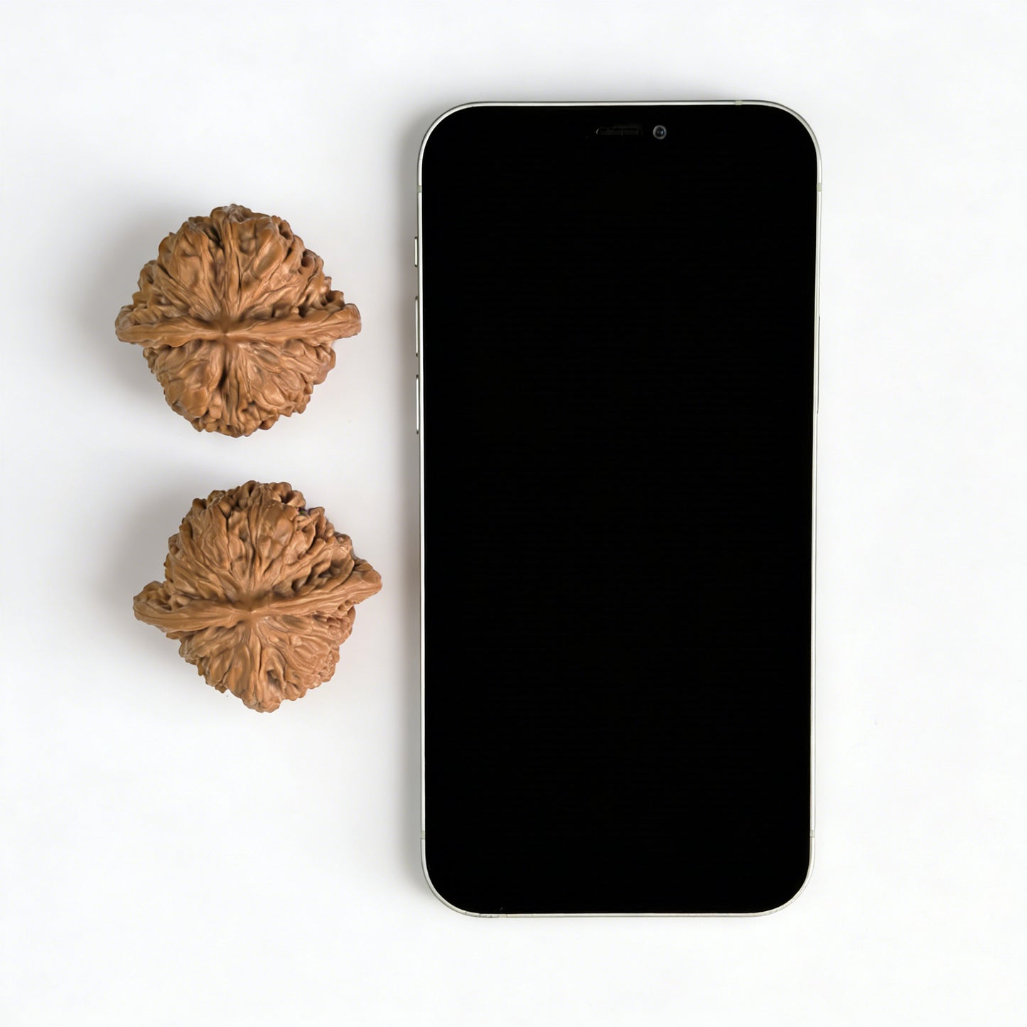 Pair of walnut lion head hand exercisers from ThePatinaProject, measuring 43mm x 40mm, with detailed carved lion faces.