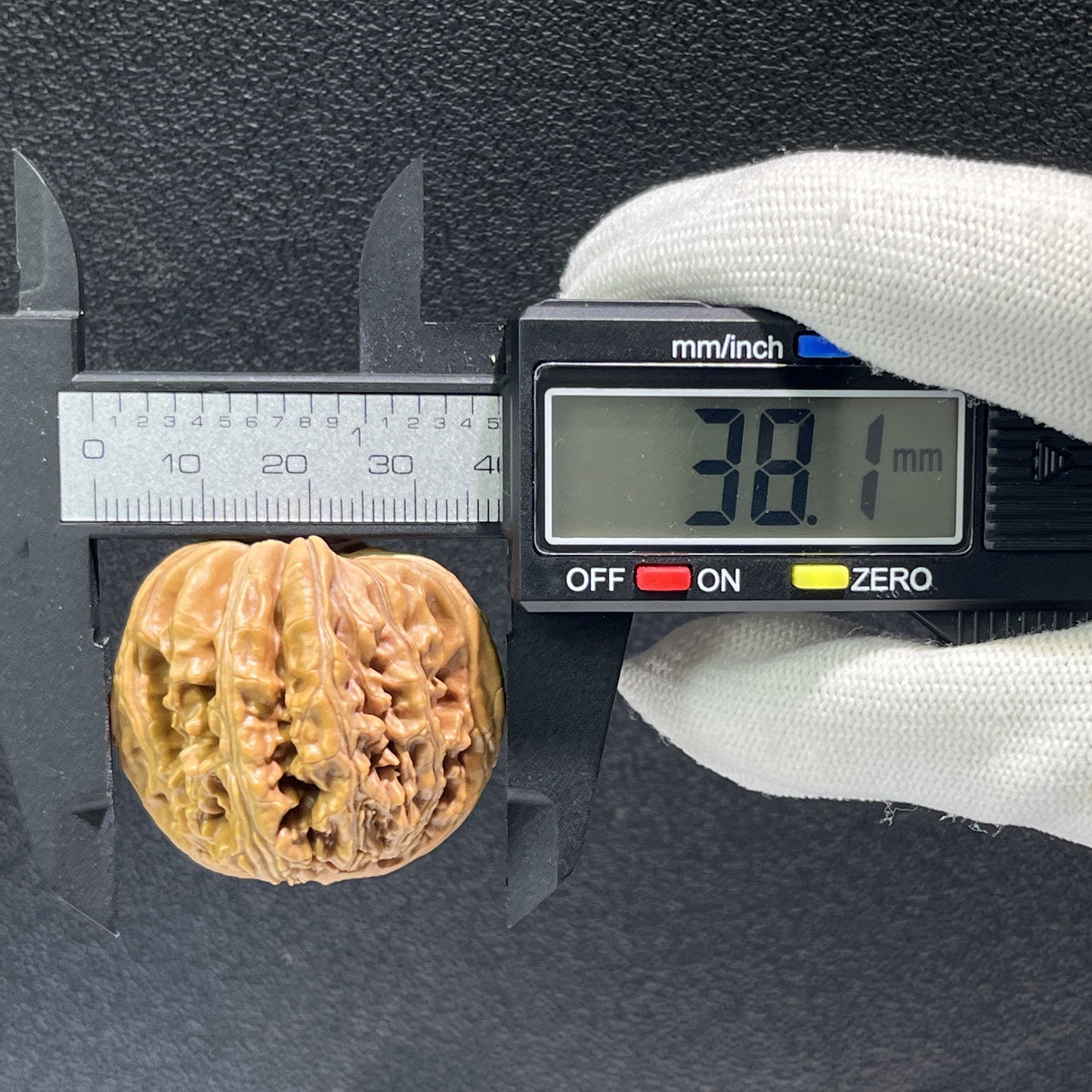 Walnut hand exercisers featuring lion's head design, 38mm size, from ThePatinaProject's Si Zuo Lou collection, pair of textured grips.