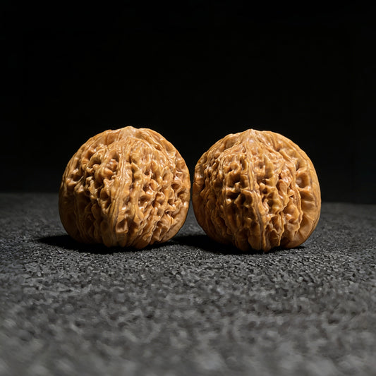 Walnut hand exercisers featuring lion's head design, 40mm x 36mm, from ThePatinaProject's Si Zuo Lou Lion's Head Pair.