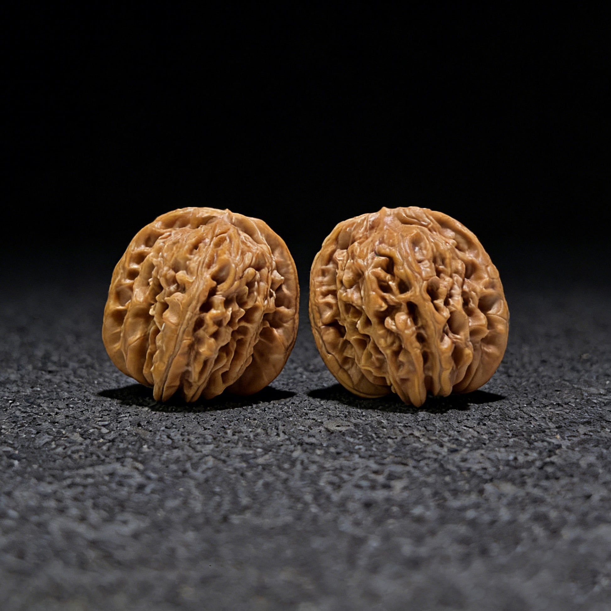 Pair of Walnut Hand Exercisers with lion's head design, 40mm x 39mm, from ThePatinaProject's Si Zuo Lou collection.