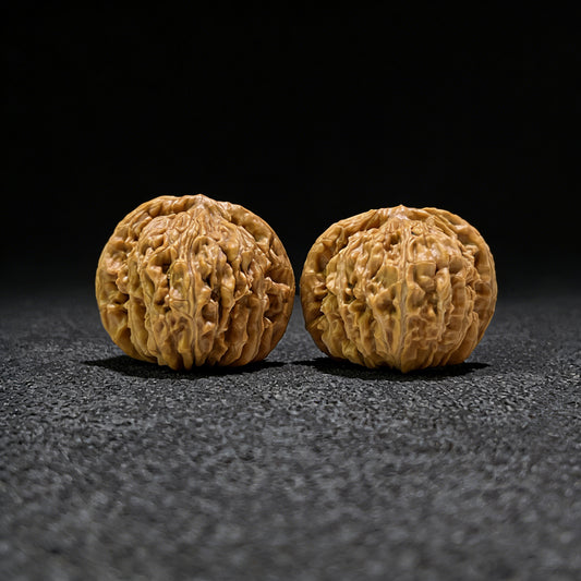Pair of walnut hand exercisers featuring lion’s head design, 43mm x 40mm, from ThePatinaProject's Si Zuo Lou collection.