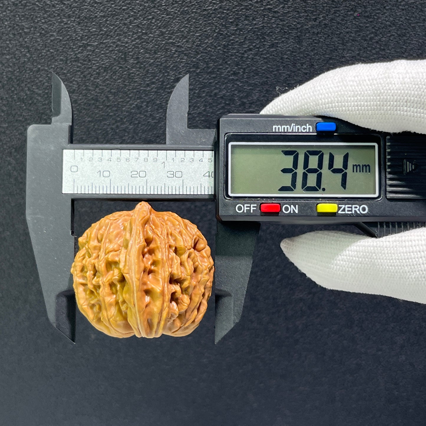 Pair of walnut hand exercisers with lion's head design, 43mm x 40mm, from ThePatinaProject's Si Zuo Lou collection.