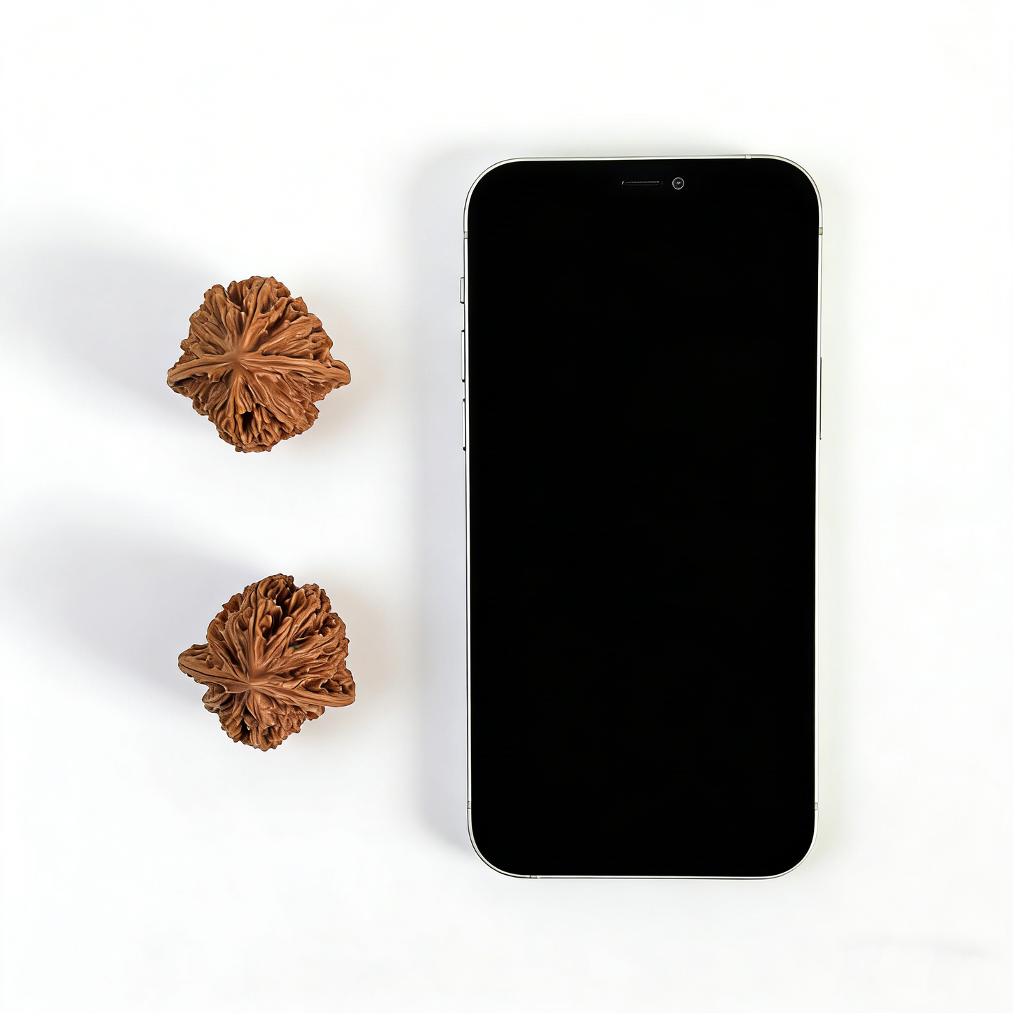 Pair of walnut hand exercisers with starry sky high-density stardust texture, 35mm collector’s size by ThePatinaProject.