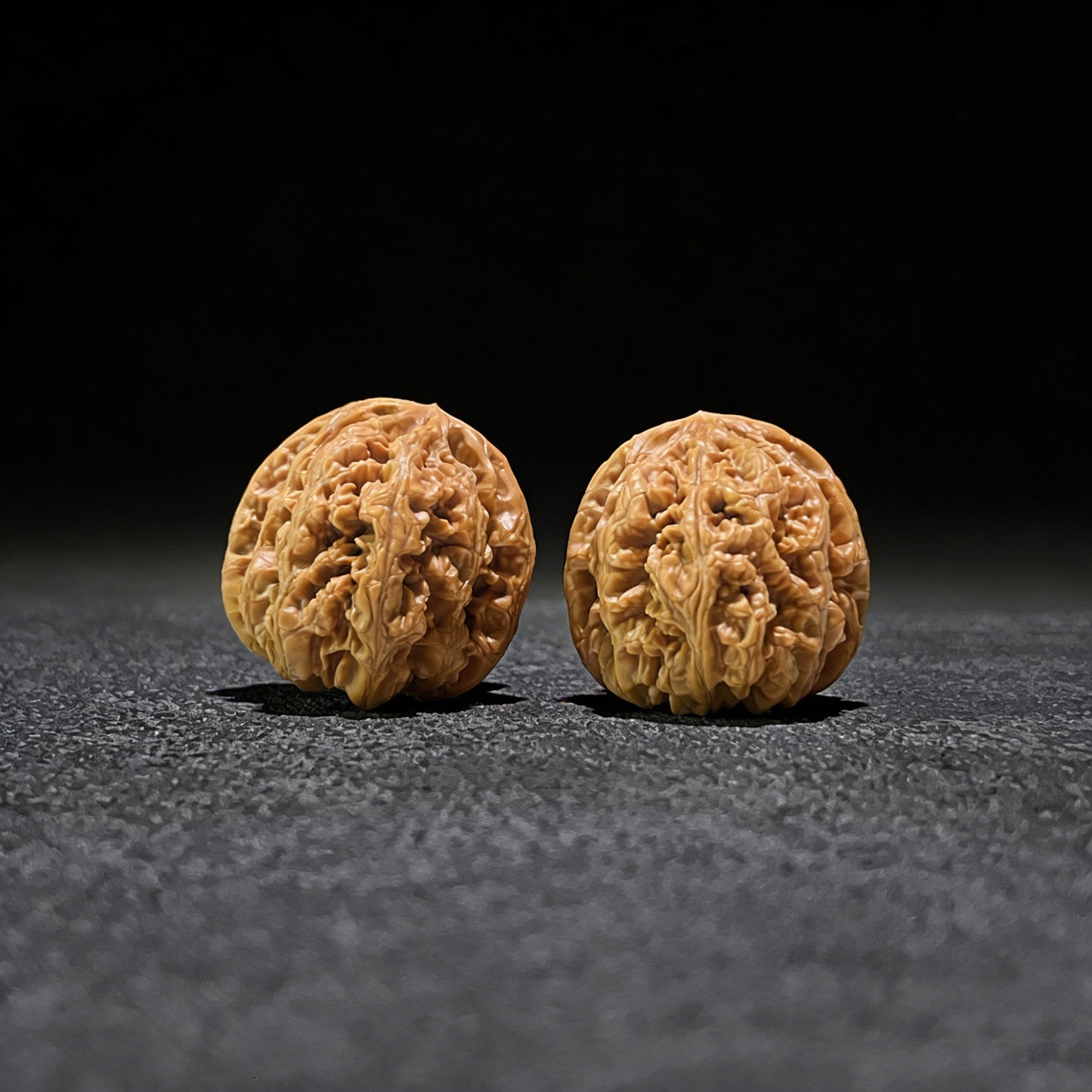 Pair of Walnut Hand Exercisers with lion's head design, Thick Ridge (Da Cu Jin), 41mm x 44mm, by ThePatinaProject.