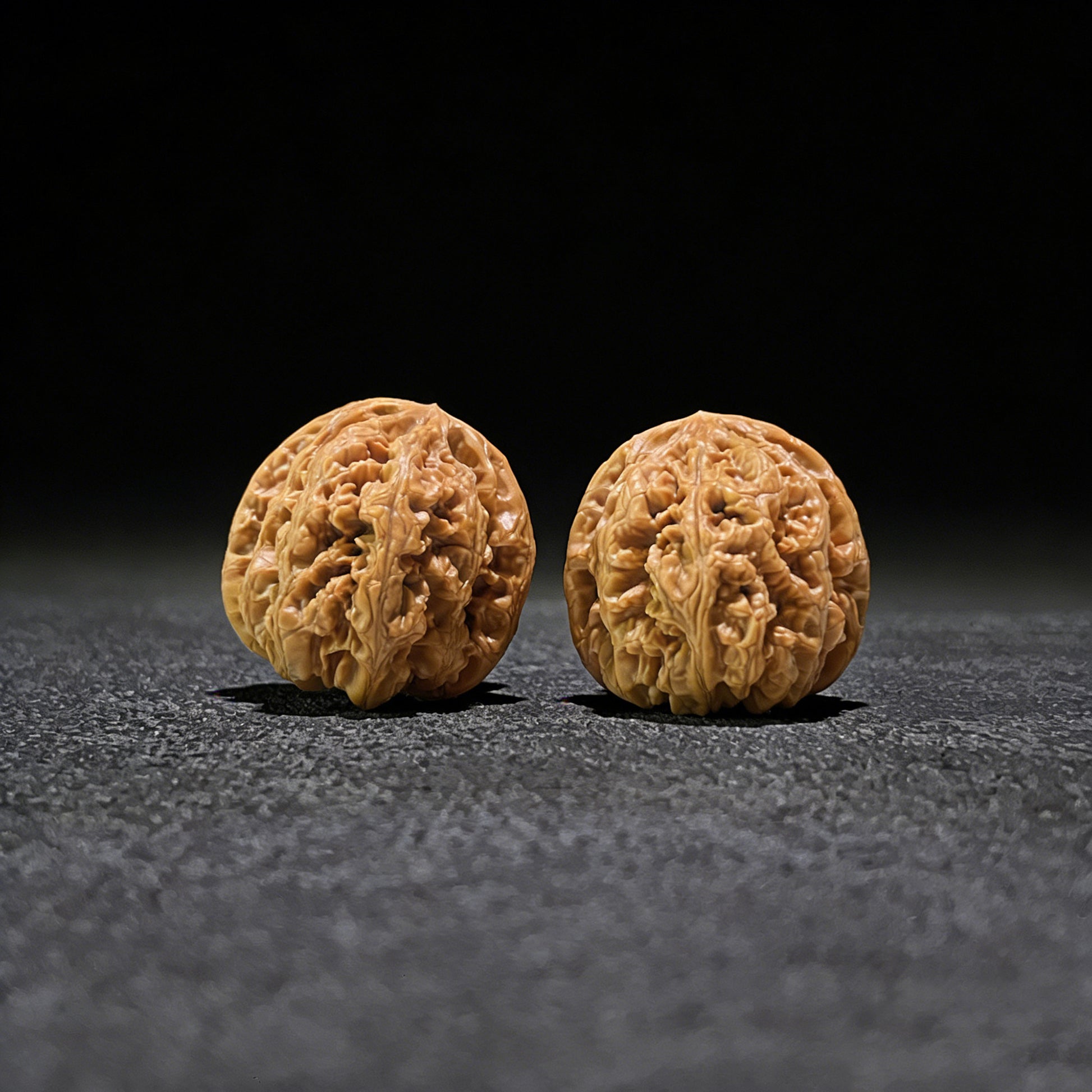 Pair of Walnut Hand Exercisers with lion's head design, Thick Ridge (Da Cu Jin), 41mm x 44mm, by ThePatinaProject.