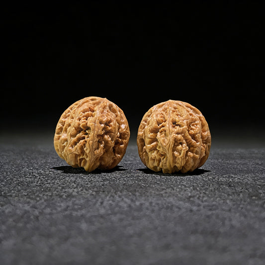 Pair of Walnut Hand Exercisers with lion's head design, Thick Ridge (Da Cu Jin), 41mm x 44mm, by ThePatinaProject.