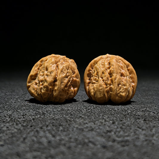 Walnut hand exercisers pair with "Toad Head" design, 36mm x 40mm, from ThePatinaProject, showing textured walnut surface and ergonomic shape.