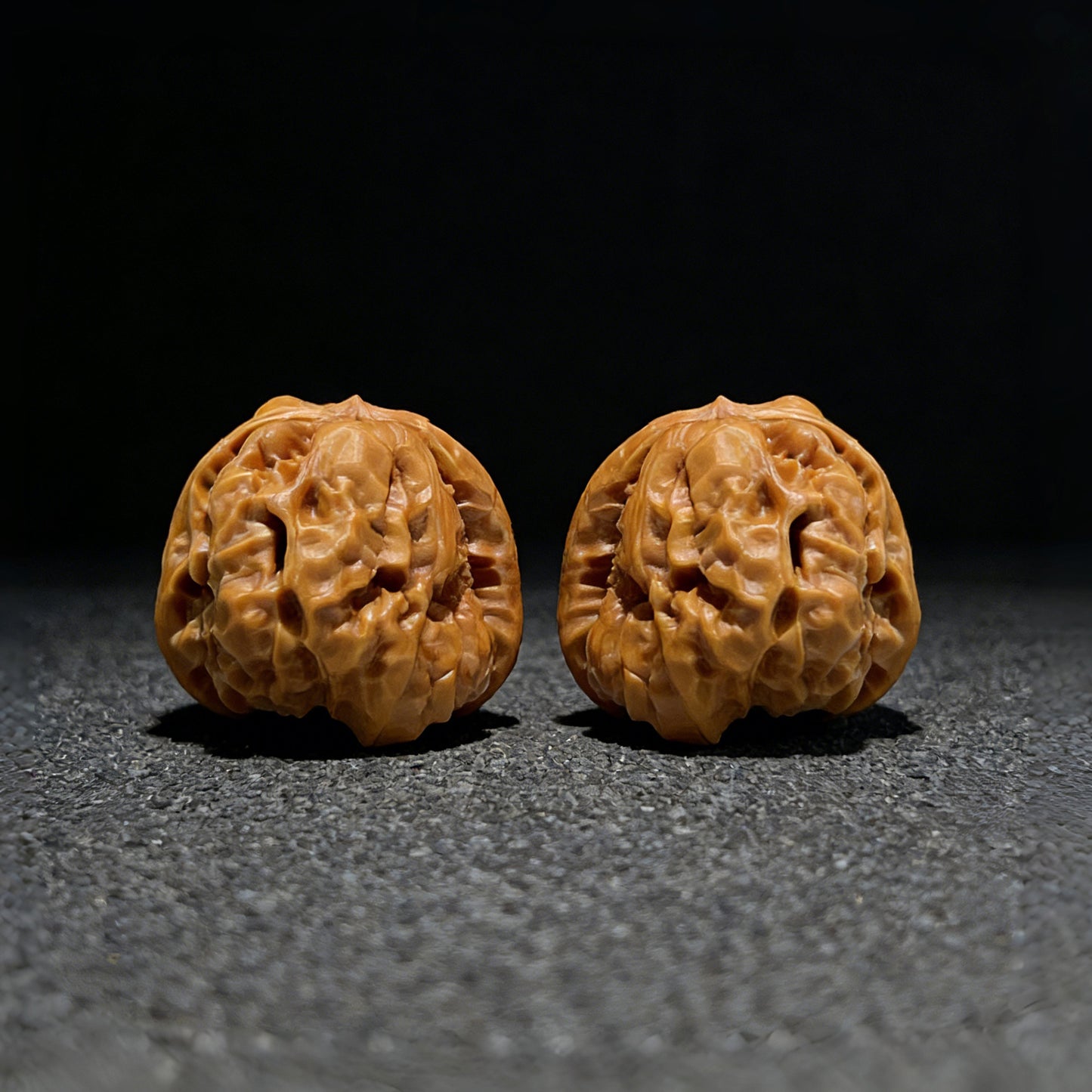 Pair of Walnut Hand Exercisers titled "Toad Head" from ThePatinaProject, 37mm x 39mm, showing detailed handcrafted wood texture.