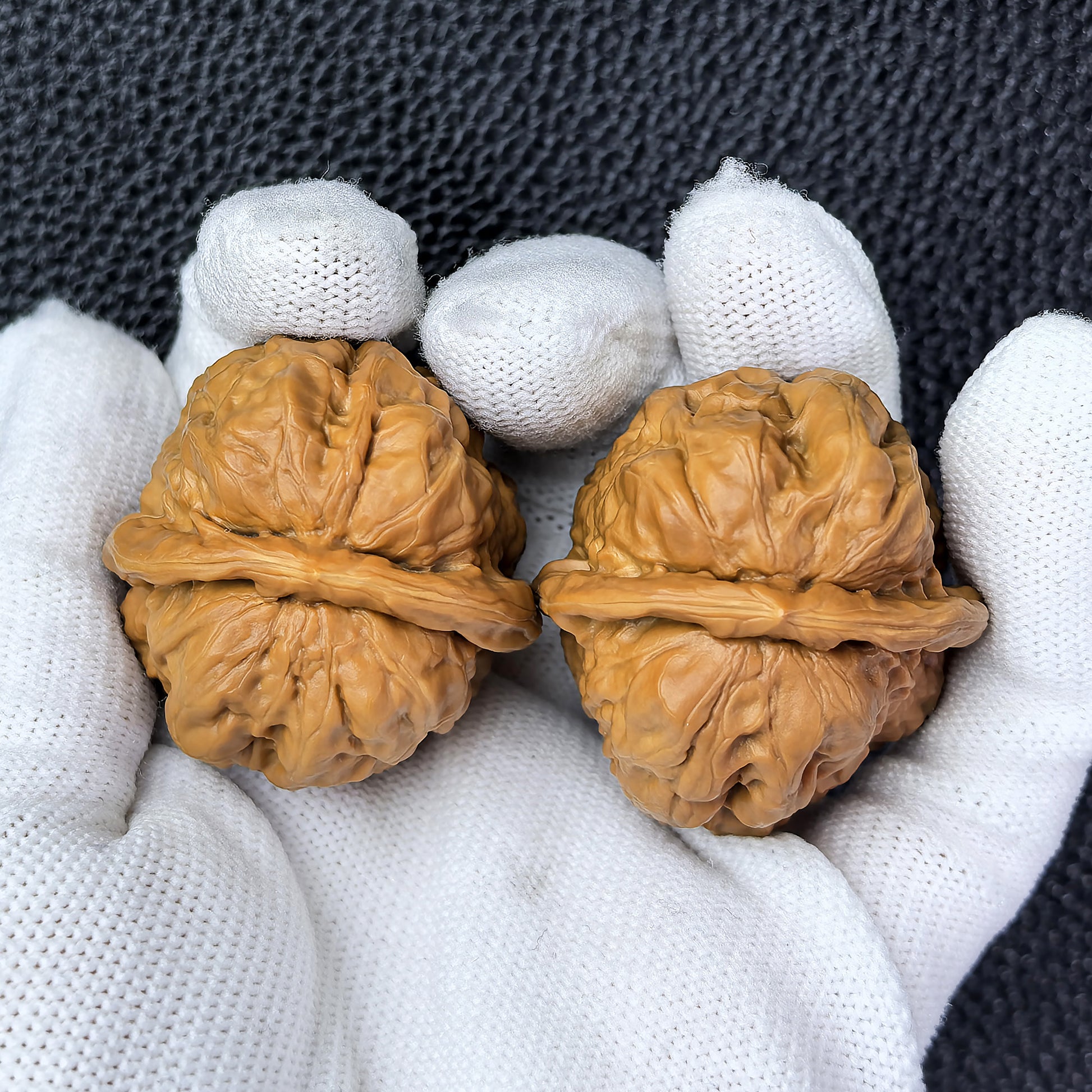 Pair of walnut hand exercisers labeled "Toad Head" by ThePatinaProject, measuring 38mm x 38mm, designed for hand strengthening.